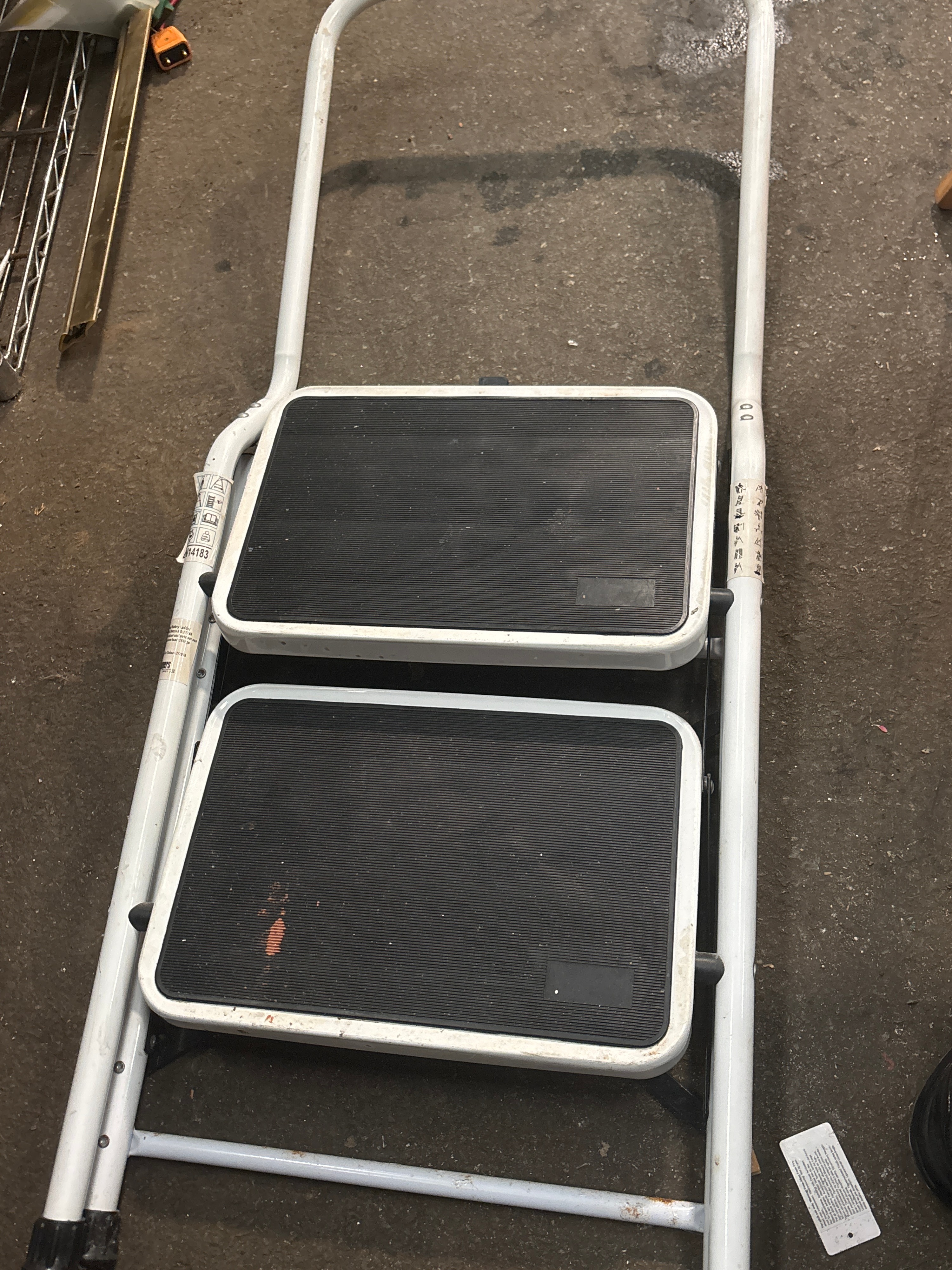A Vintage White Painted Steel Two-Step Folding Stool