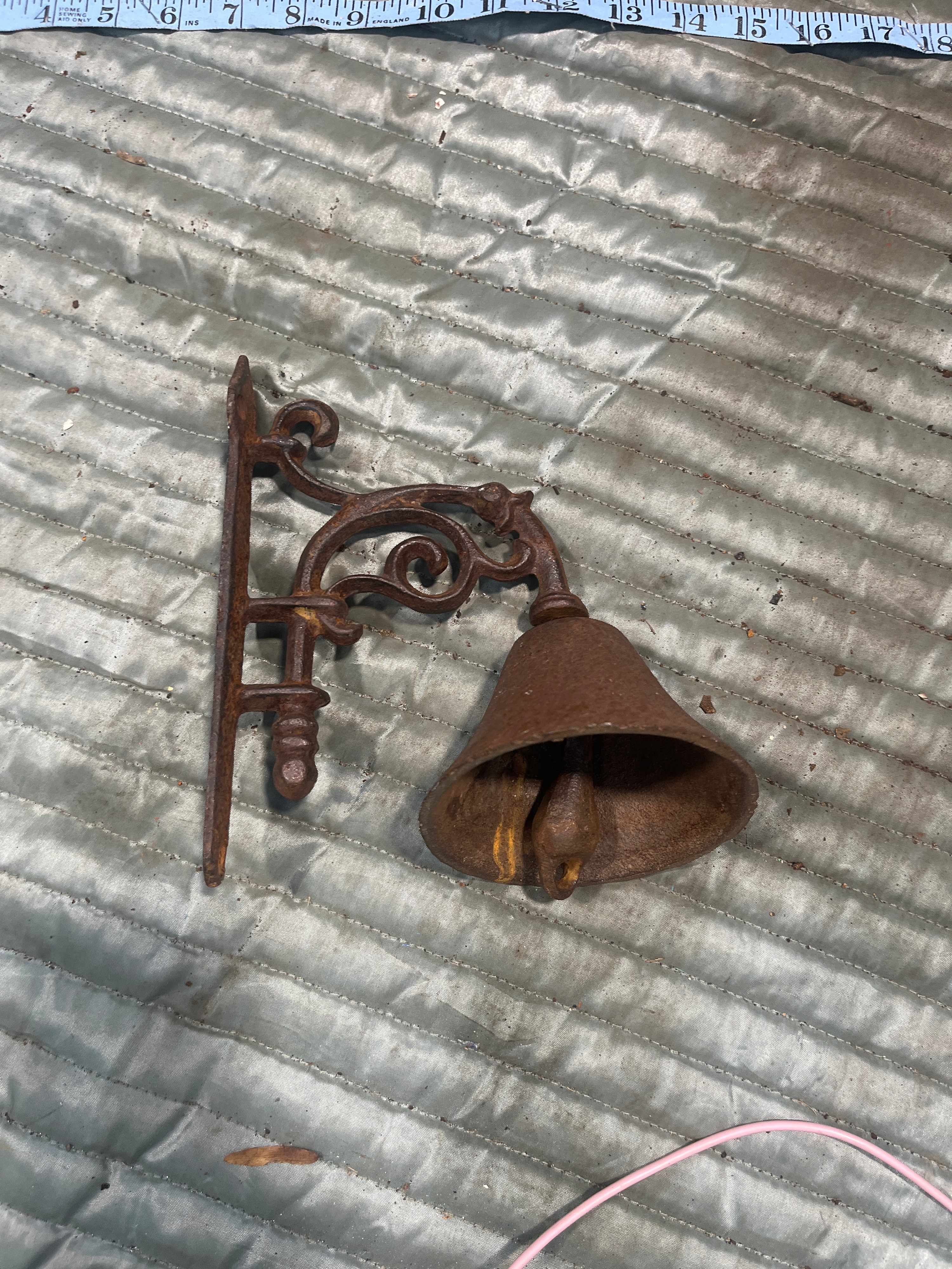A Cast Iron Wall Mounted Dinner Bell