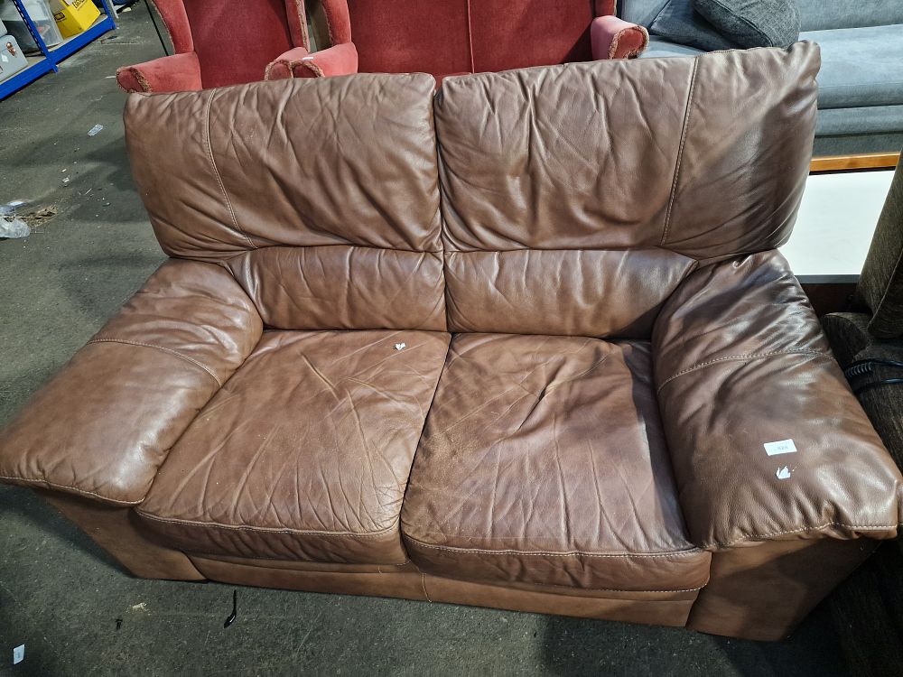 Lot 828: A Brown Leather Two-Seater Loveseat Sofa