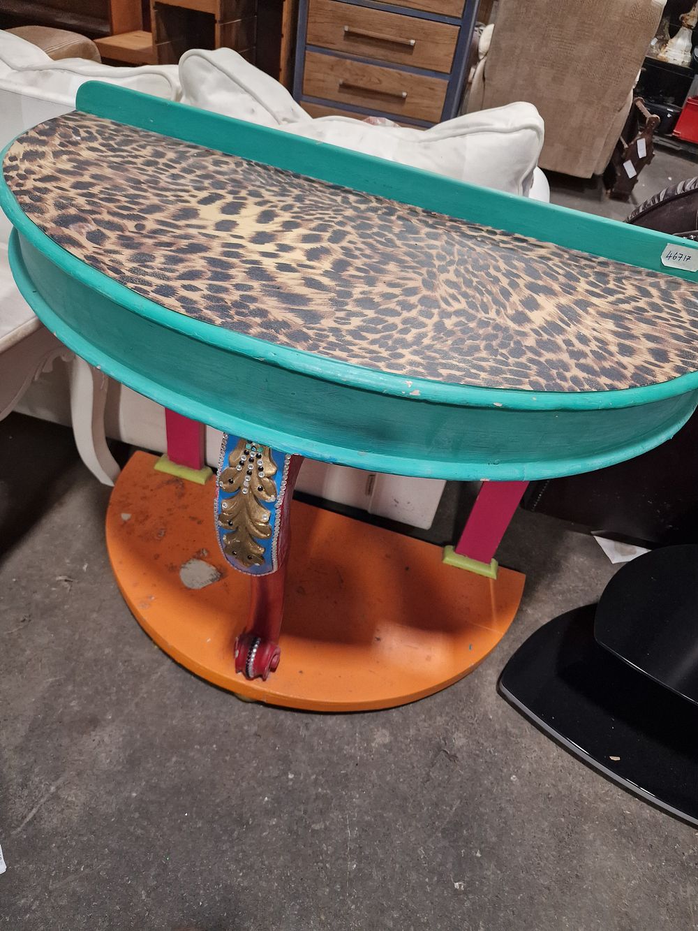Lot 835: A Maximalist Demi-Lune Console Table with Leopard Print Inset