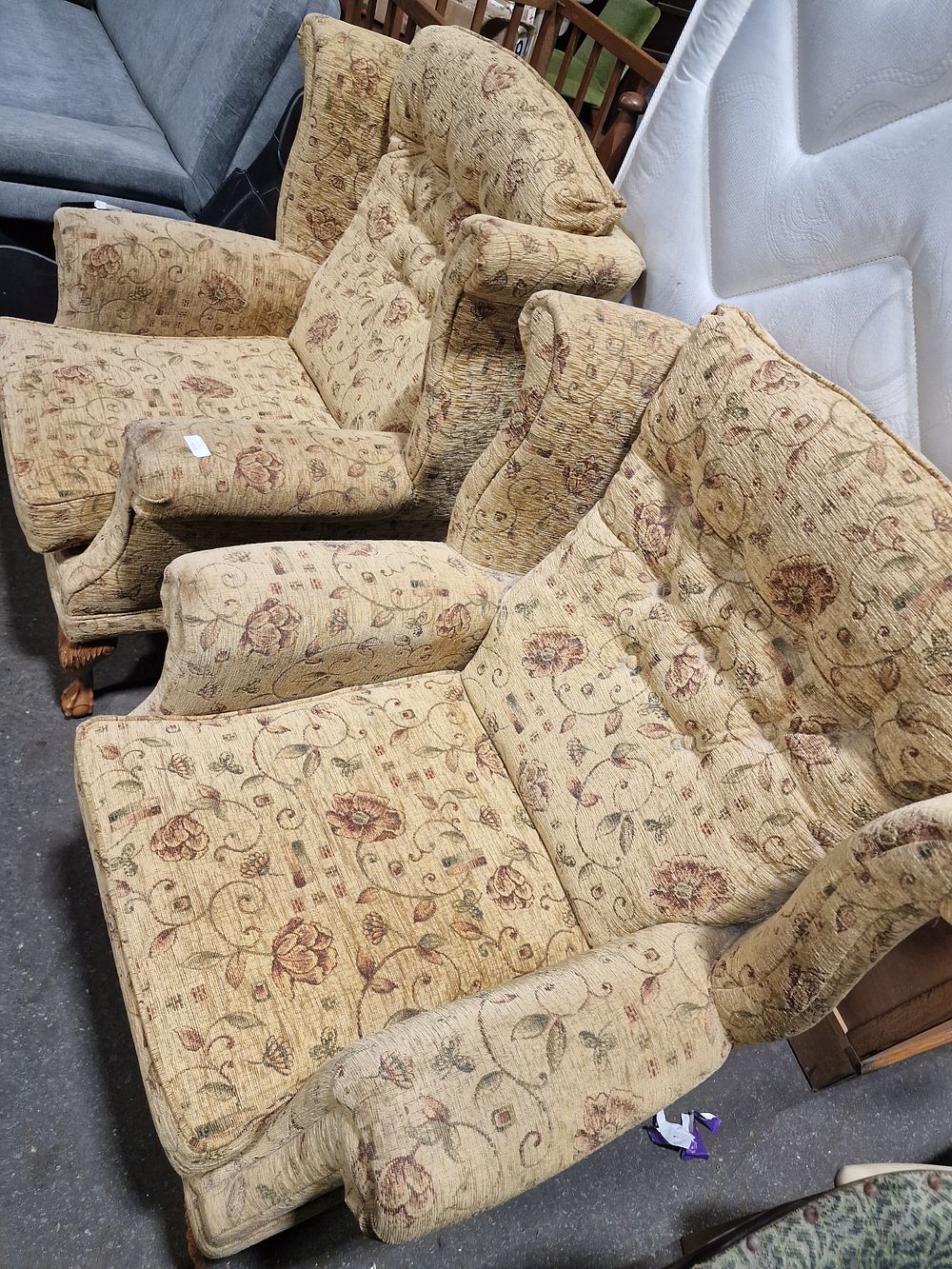 Lot 853: A Pair of Traditional Floral Upholstered Wingback Armchairs