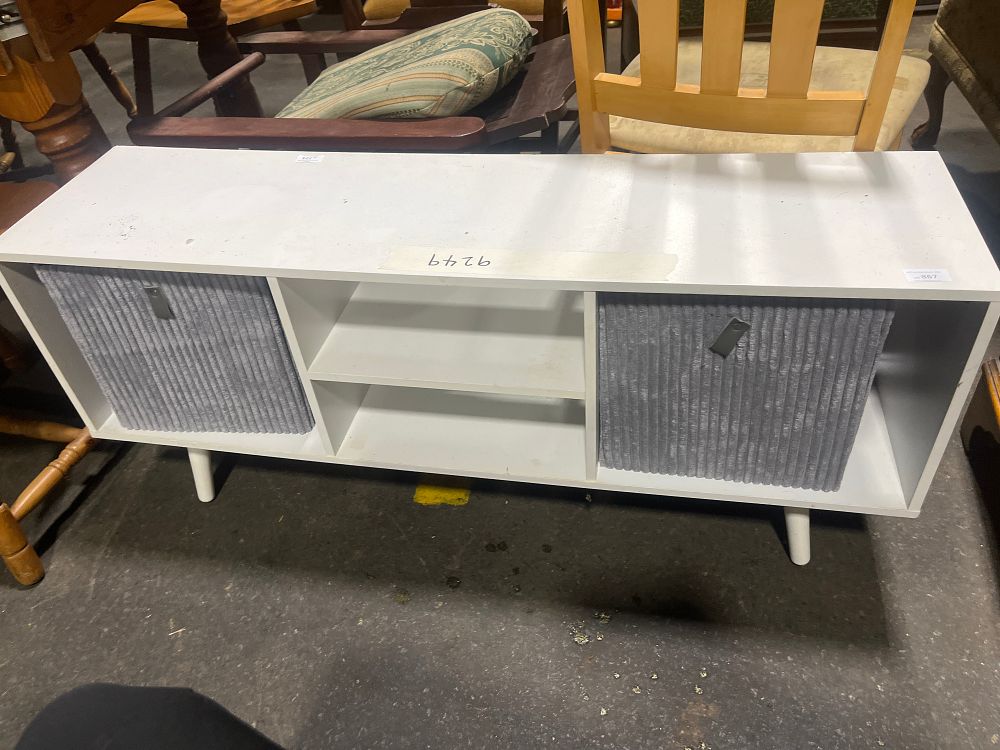 Lot 867: A White Low Media Console with Two Grey Fabric Storage Bins