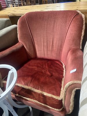 A Mid-20th Century Upholstered Armchair. A mid-20th century armchair, likely of British 
