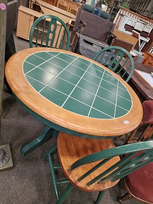 A Vintage Tiled Pedestal Dining Table and Four Windsor Style Chairs. A vintage circular 