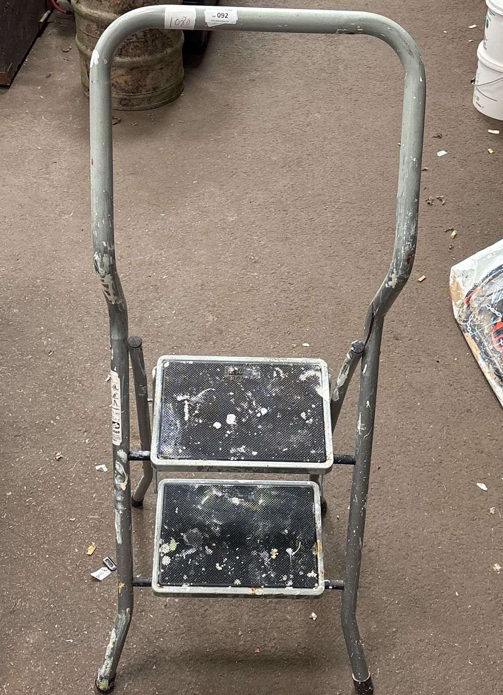 Lot 92: A Two-Step Folding Metal Step Ladder with Safety Rail