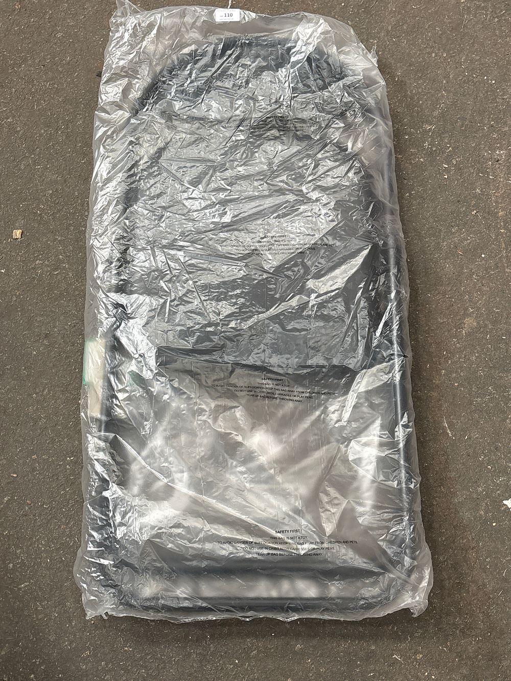 Lot 110: A Brand New The Range Upholstered Black Folding Chair