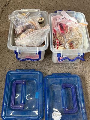 An Assortment of Plastic Storage Bins with Craft Supplies. An assortment of plastic storage bins 