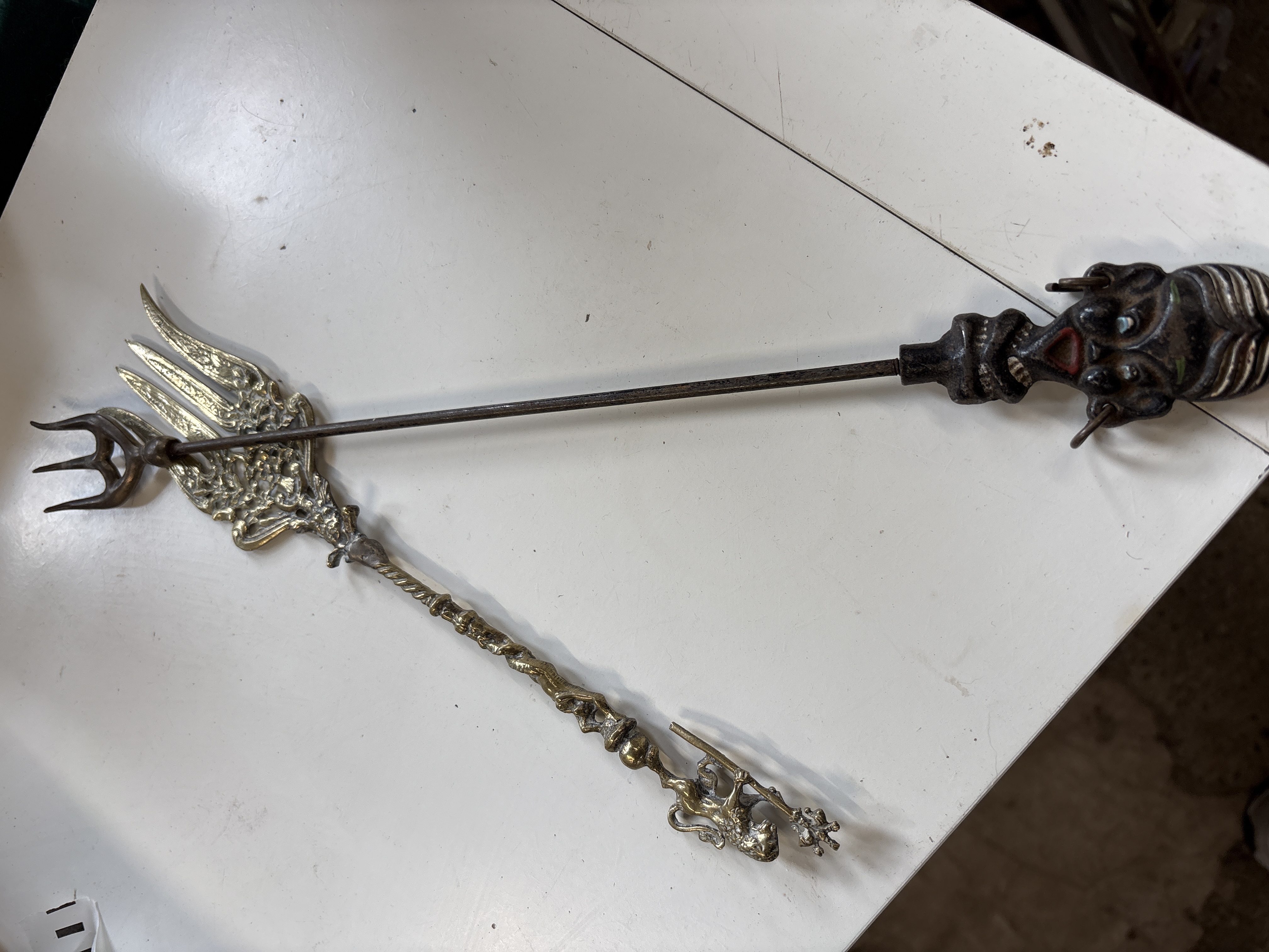 Two Antique Decorative Metal Toasting Forks including a Grotesque Imp Example