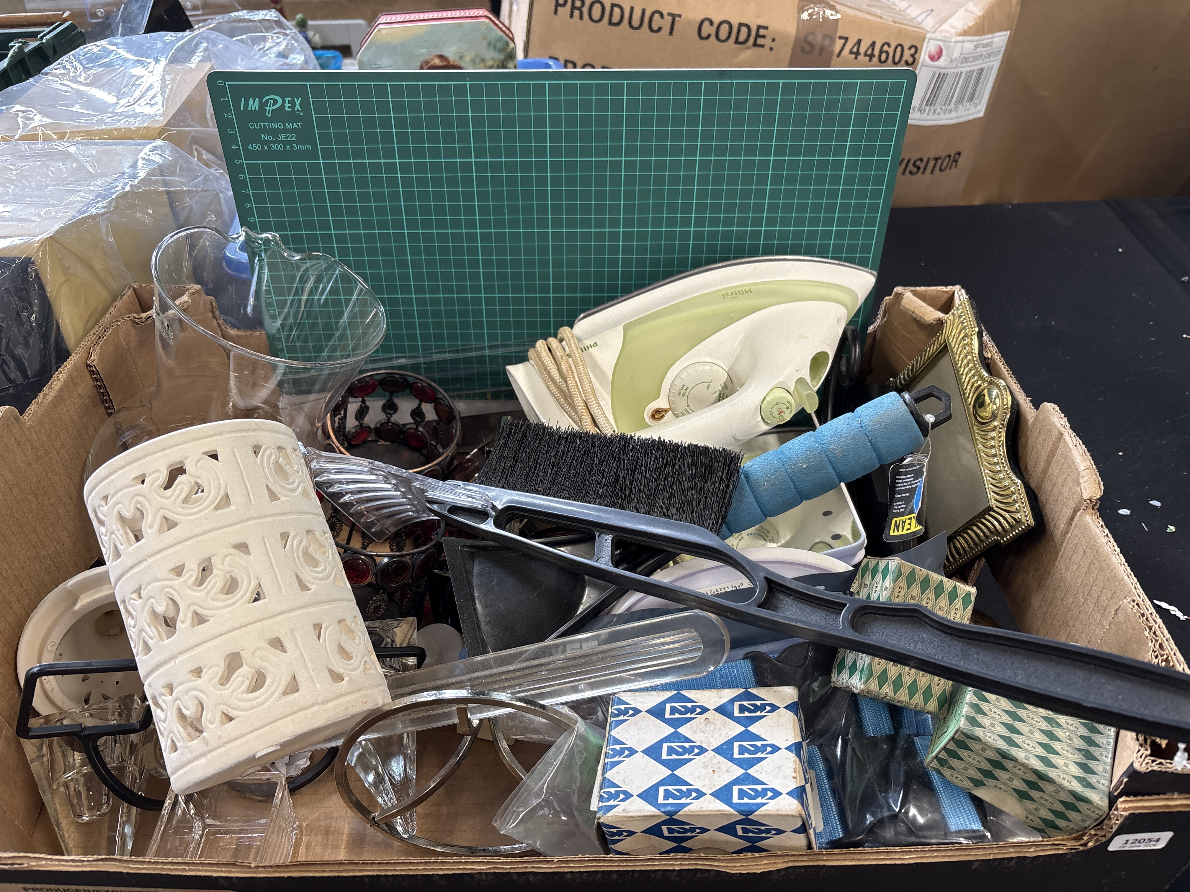 A Collection of Various Household Items Including an IMPEX Cutting Mat and a Mistral Iron