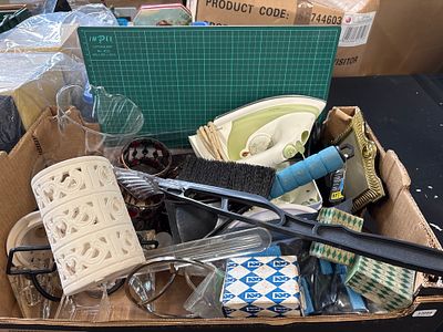 A Collection of Various Household Items Including an IMPEX Cutting Mat and a Mistral Iron. .