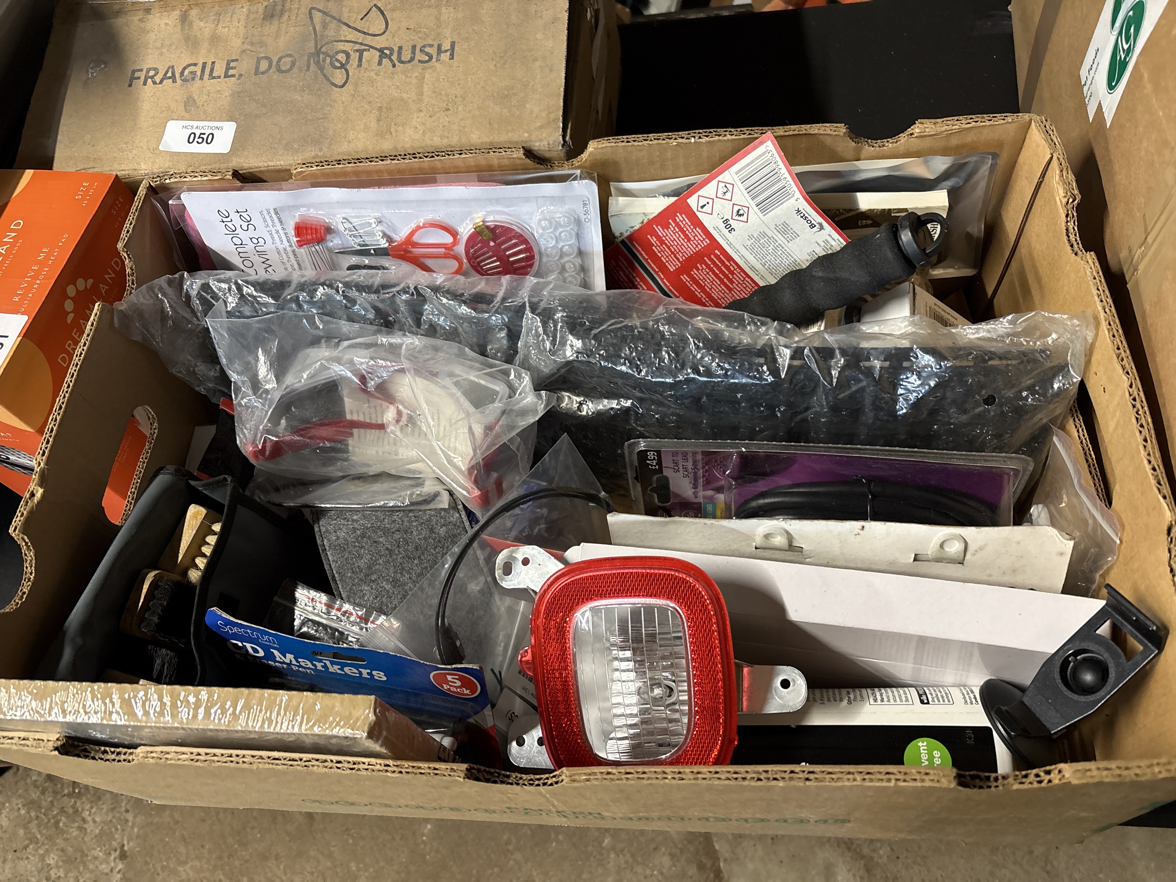 An Assortment of Household Craft and Automotive Goods Including Dreamland Heat Pad and Trailer Light