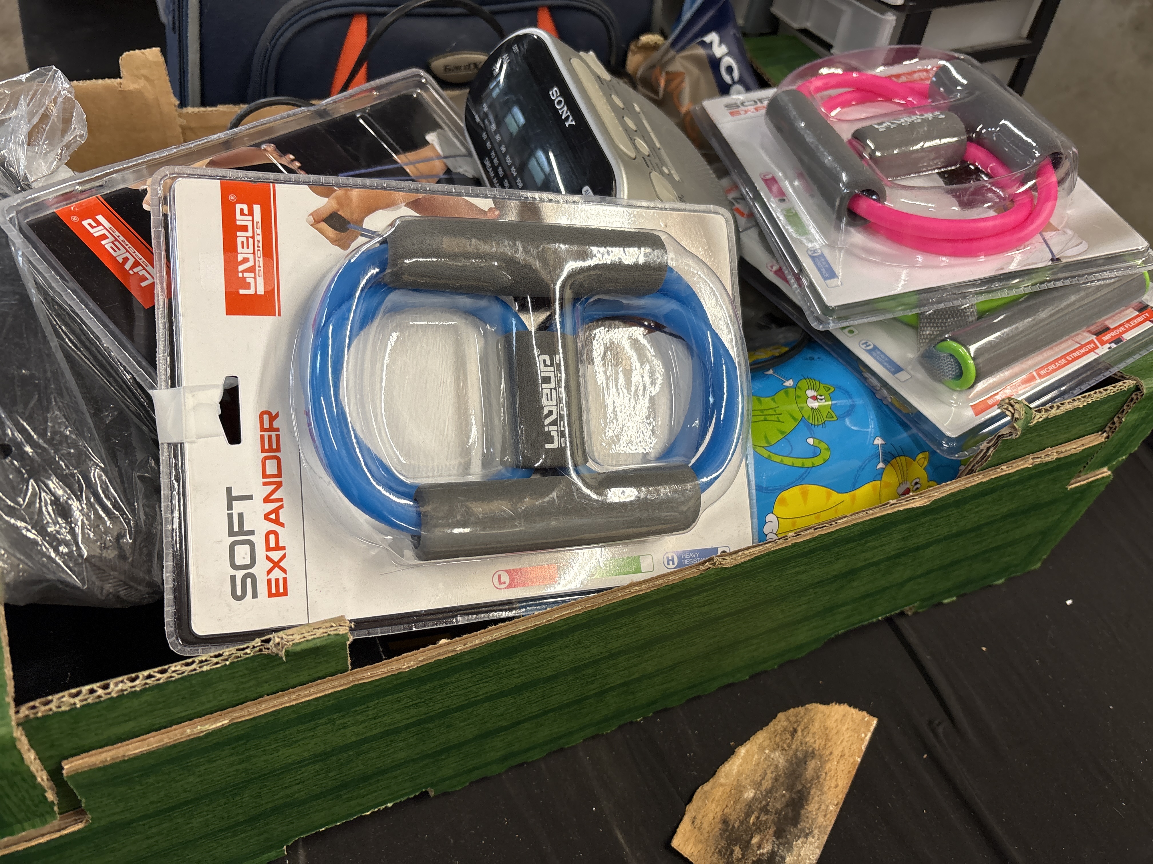 An Assortment of Liveup Sports Fitness Equipment and a Sony Dream Machine Clock Radio