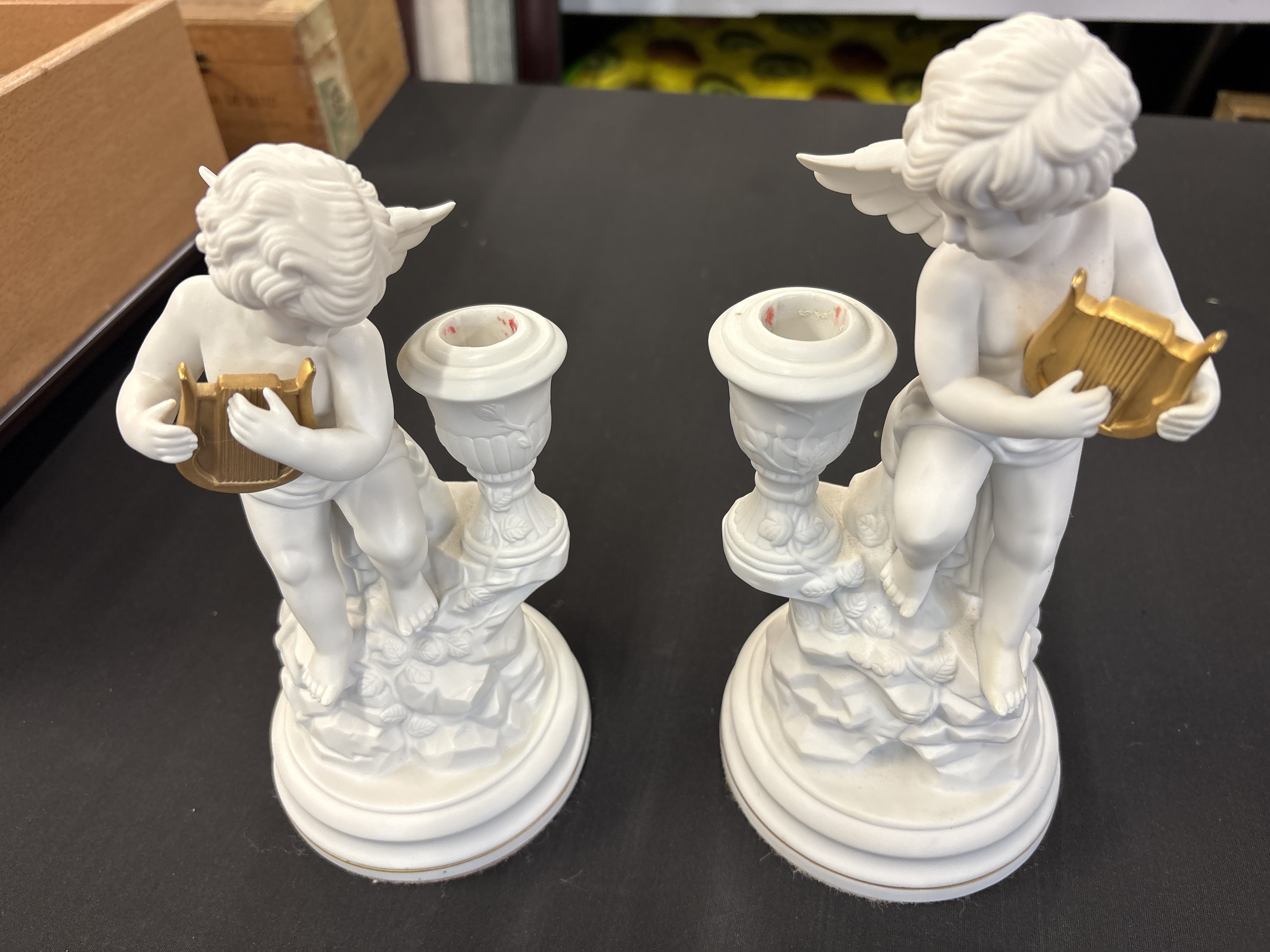 A Pair of Franklin Mint Amorini di Pompeii Bisque Porcelain Cherub Candle Holders