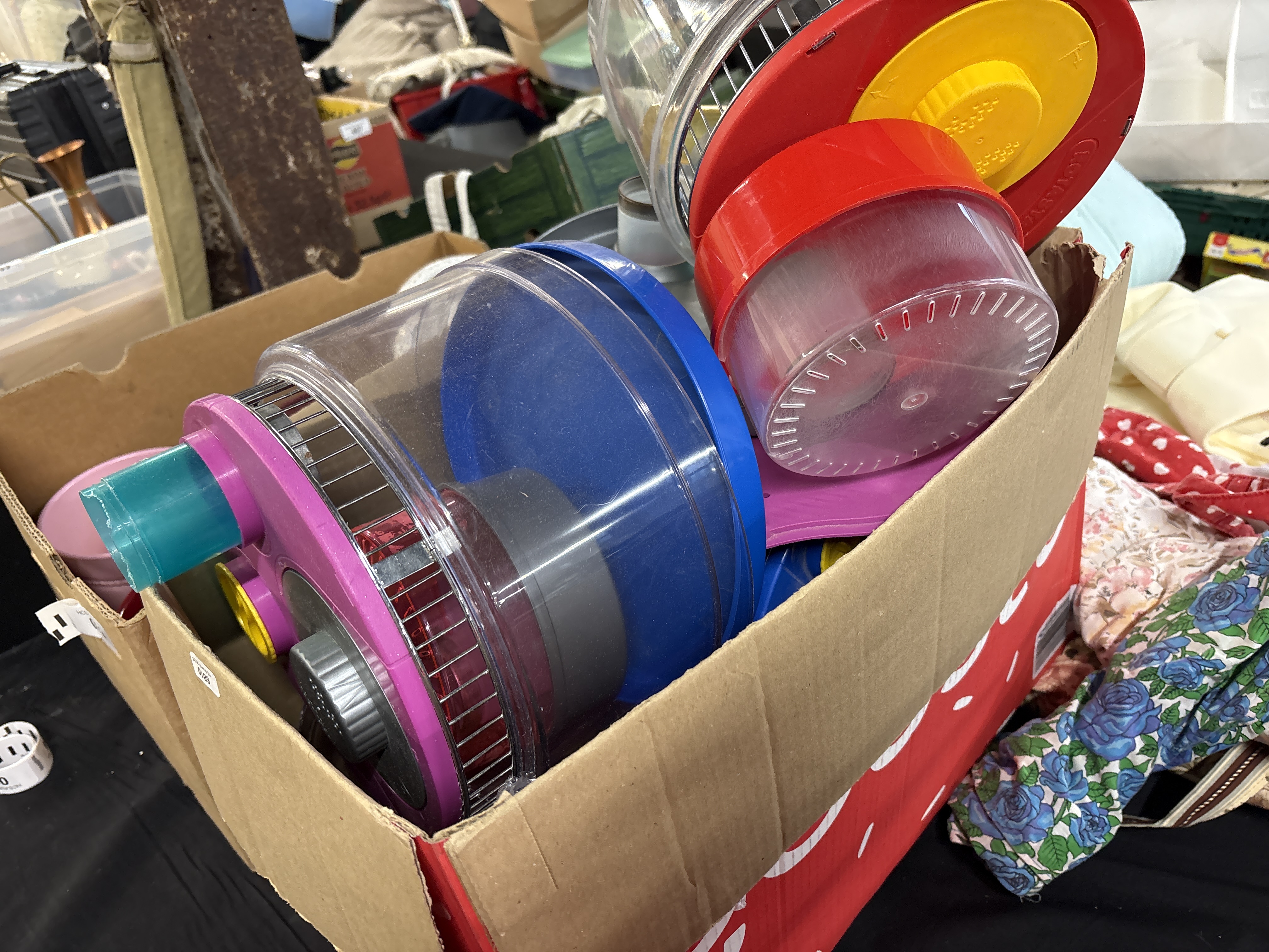 A Collection of Ferplast and Assorted Plastic Hamster Wheels and Exercise Accessories