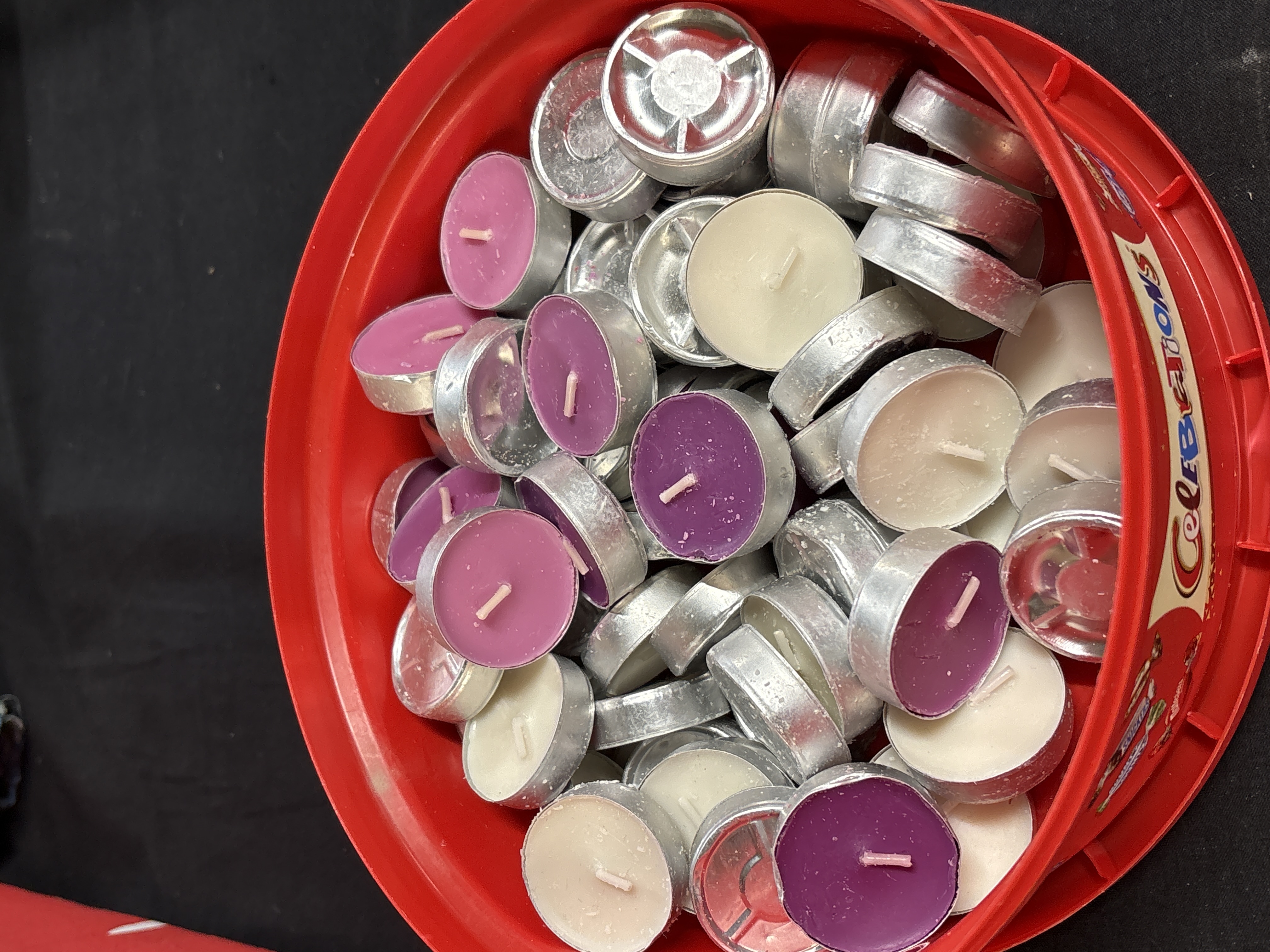 An Assortment of Lavender, Purple, and White Tealight Candles