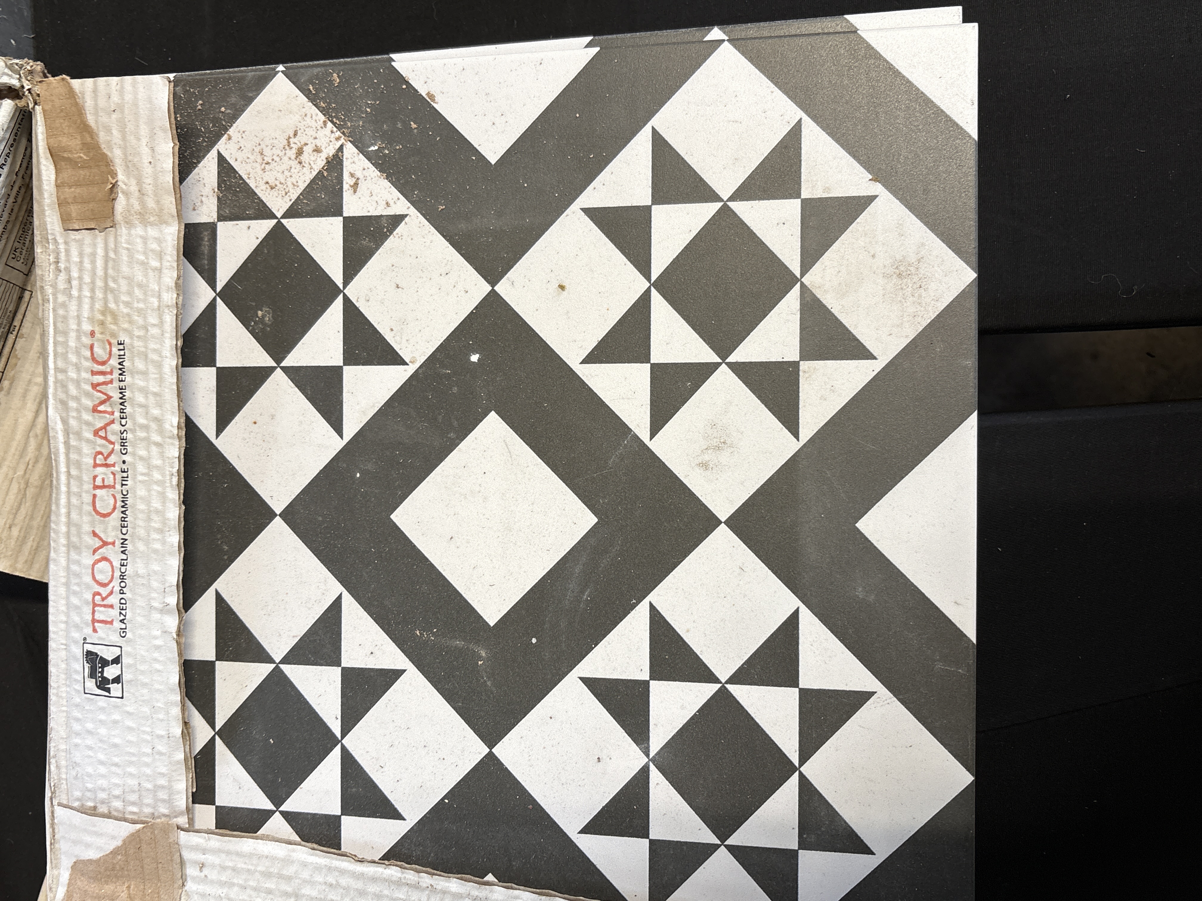 A Collection of Troy Ceramic Geometric Patterned Porcelain Tiles