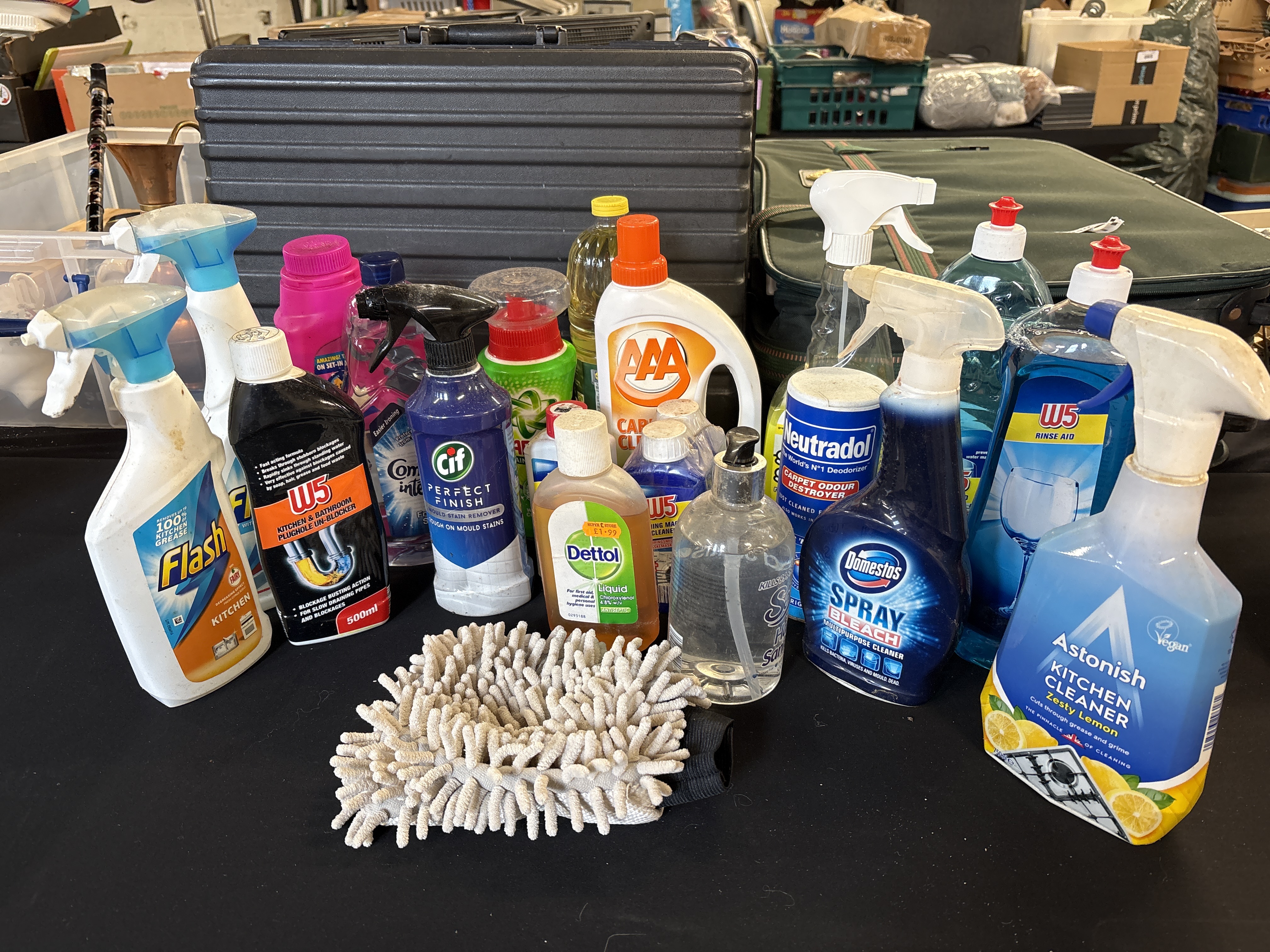 An Assortment of Branded Household Cleaning Products with Utility Cases