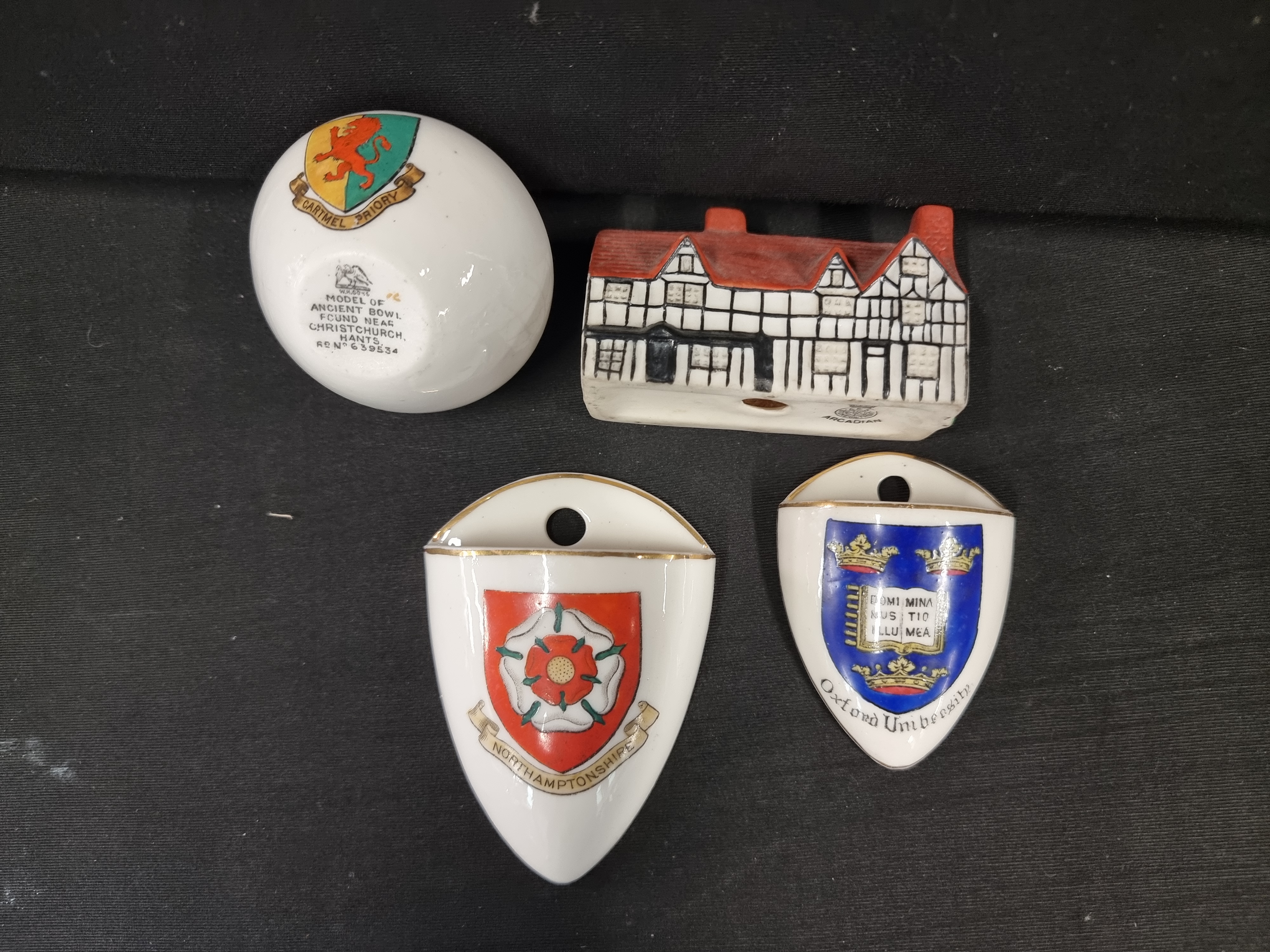 A Collection of Four Pieces of Crested Porcelain and Miniature Souvenir Ware by W.H. Goss and Arcadian