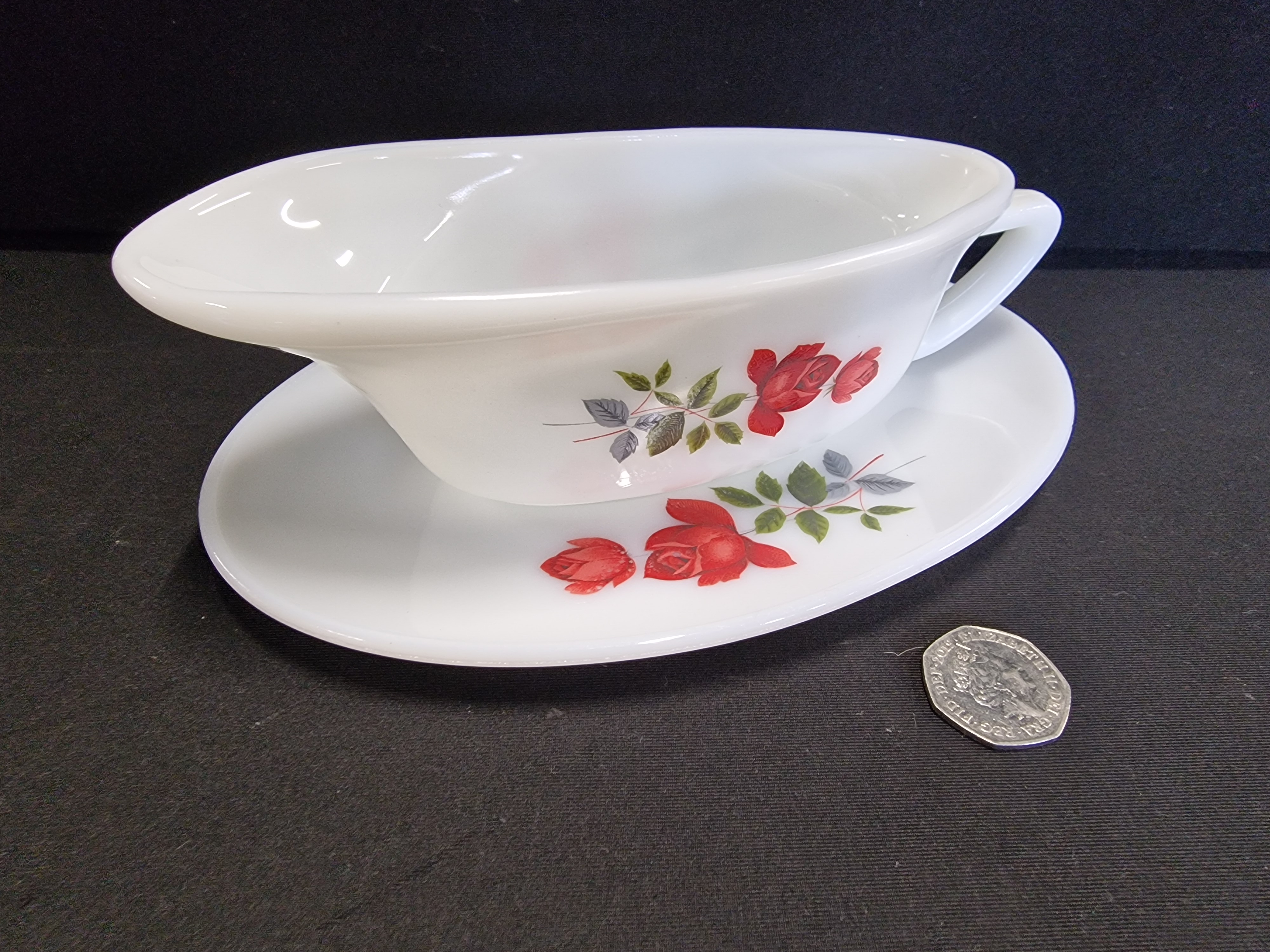 A JAJ Pyrex June Rose Pattern Gravy Boat and Stand