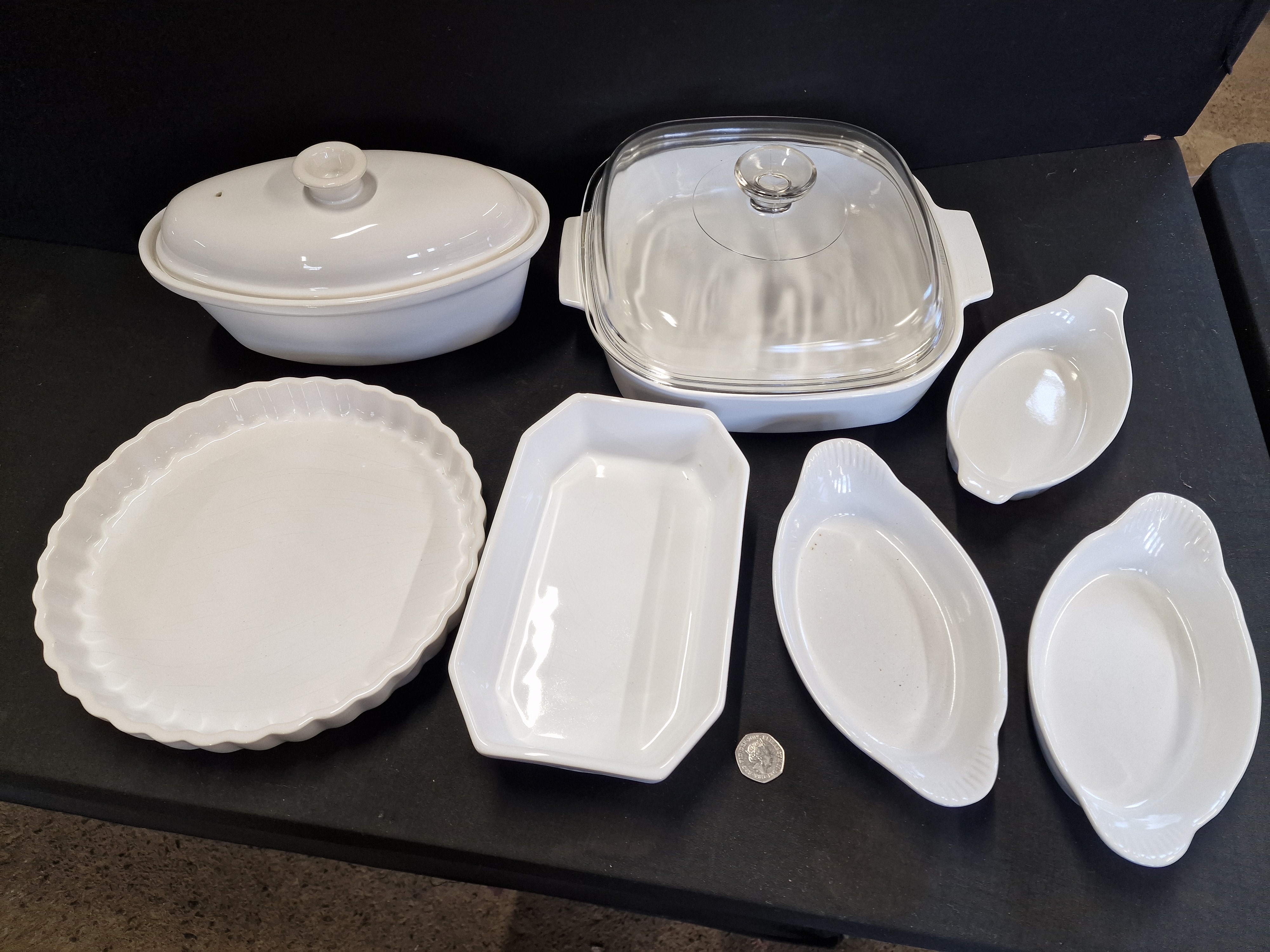 A Collection of Seven White Ceramic Oven-to-Table Serving Dishes