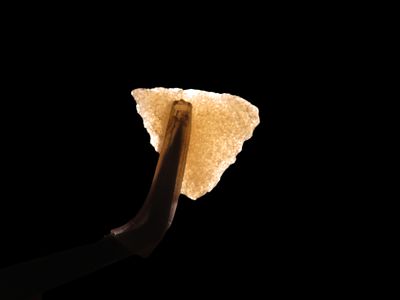 Nice Hixton Quartz Triangle found in Wisconsin. Thin and well flaked, Highly Translucent and 