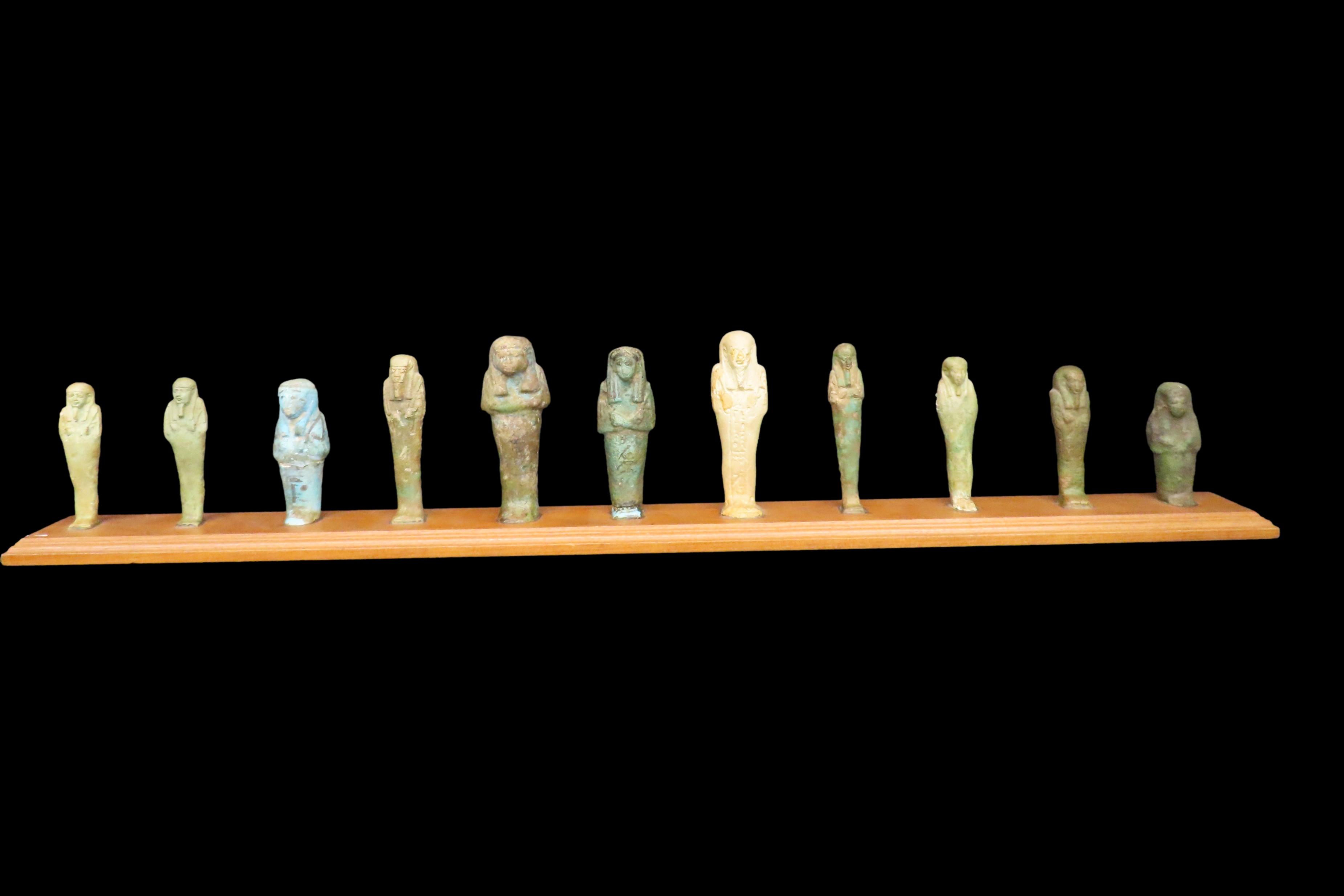 33" x 3" Wooden Display Containing 11 Egyptian Ushabtis, All Different Examples