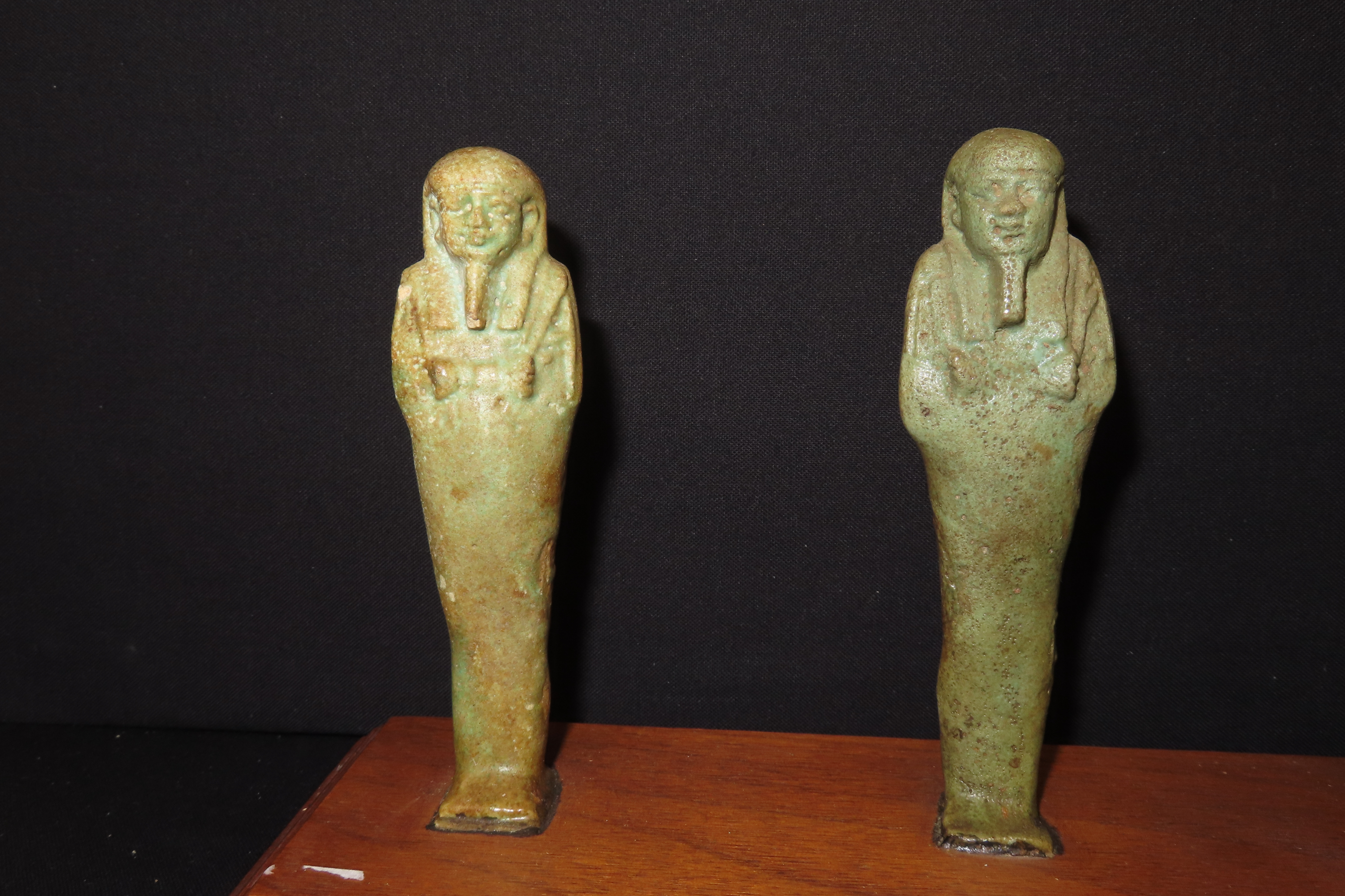 33" x 3" Wooden Display Containing 11 Egyptian Ushabtis, All Different Examples
