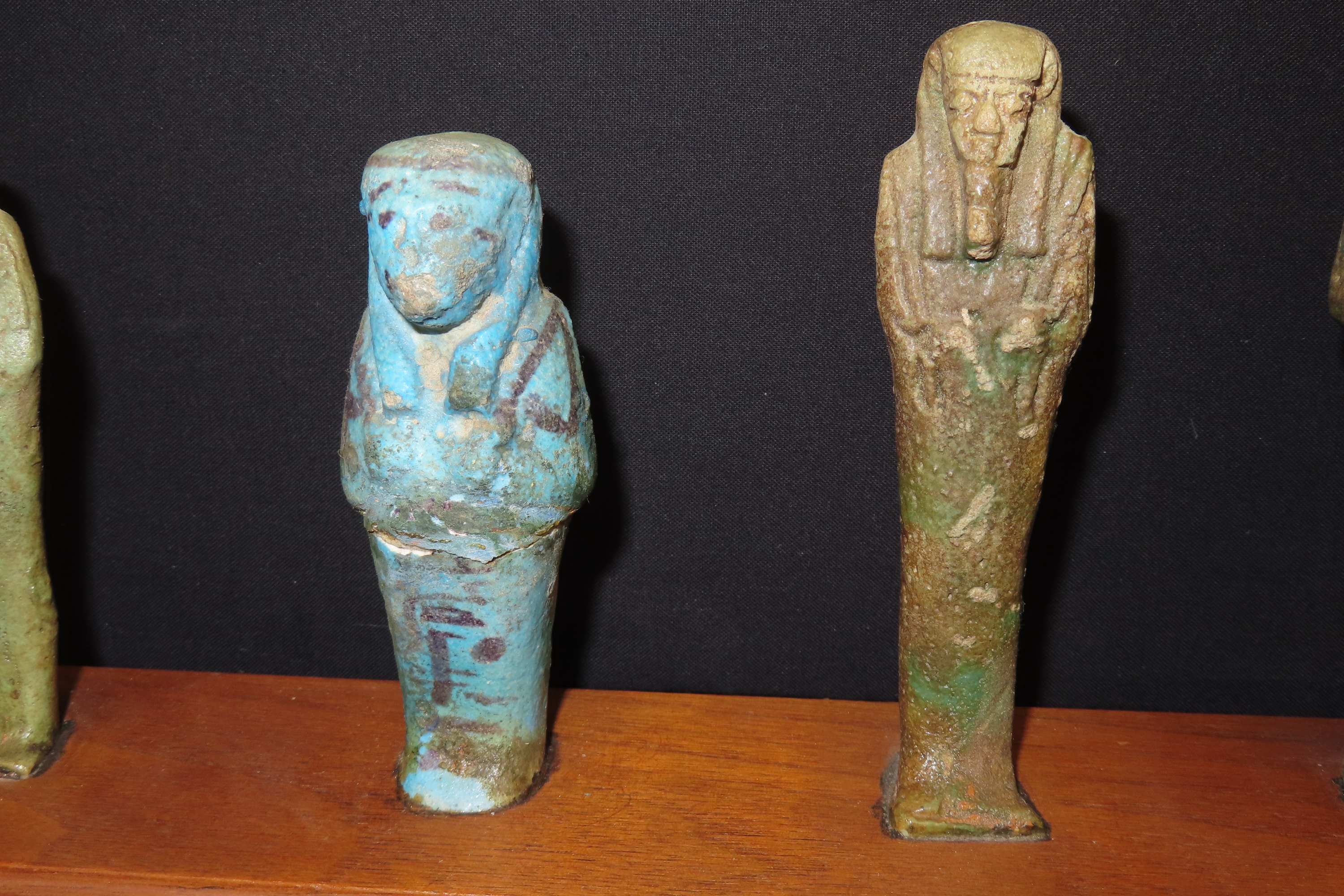 33" x 3" Wooden Display Containing 11 Egyptian Ushabtis, All Different Examples