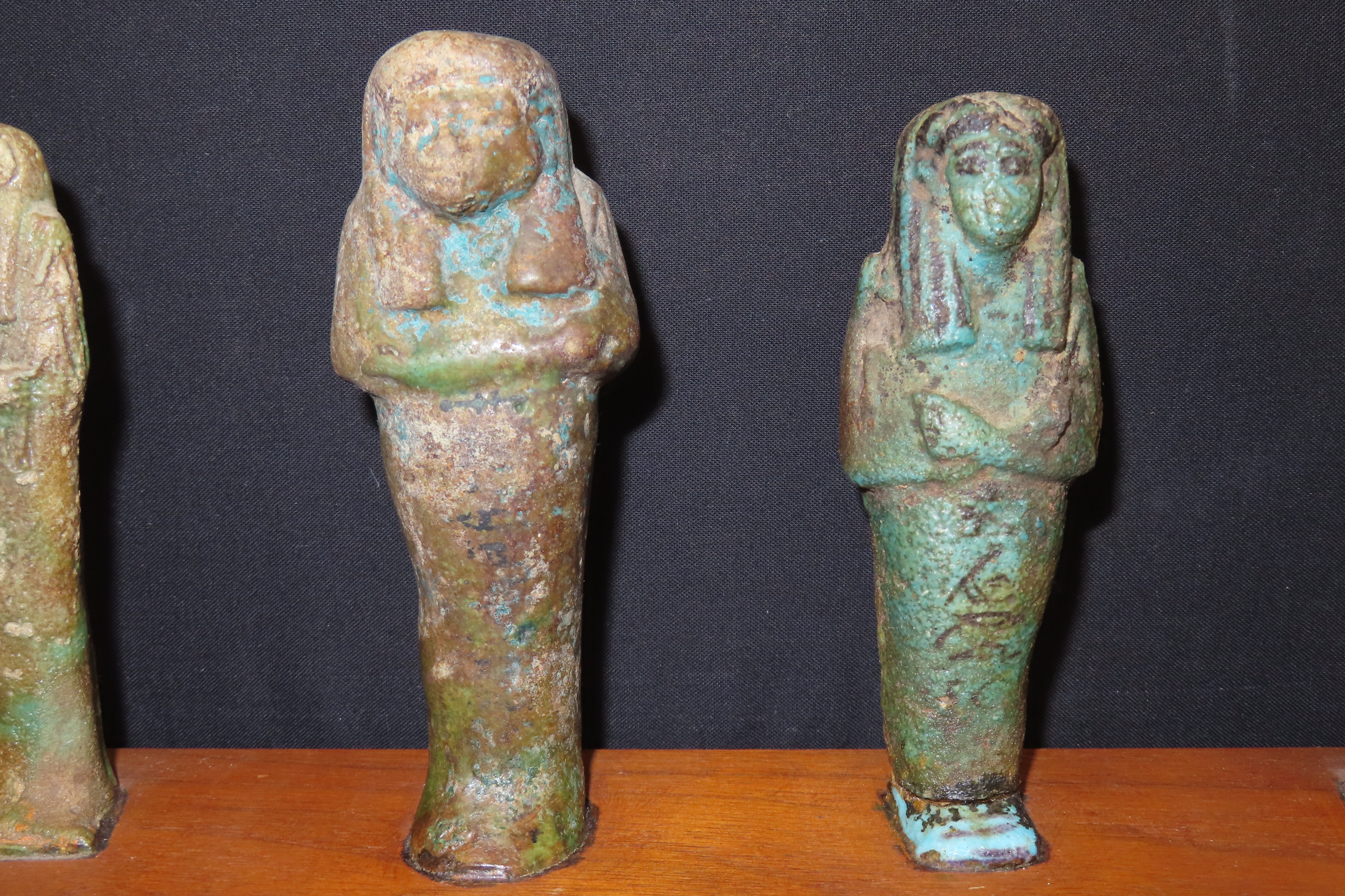 33" x 3" Wooden Display Containing 11 Egyptian Ushabtis, All Different Examples