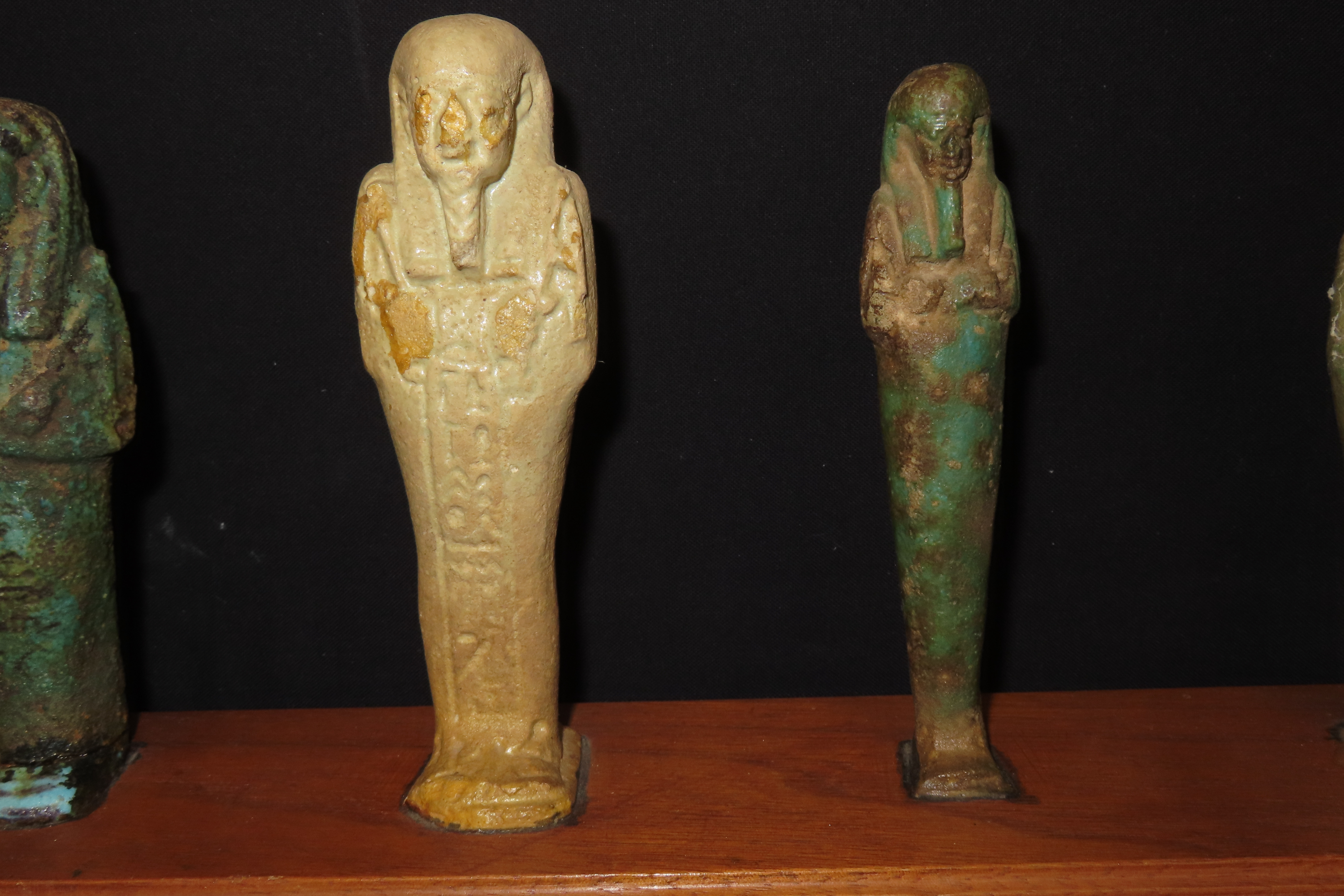 33" x 3" Wooden Display Containing 11 Egyptian Ushabtis, All Different Examples