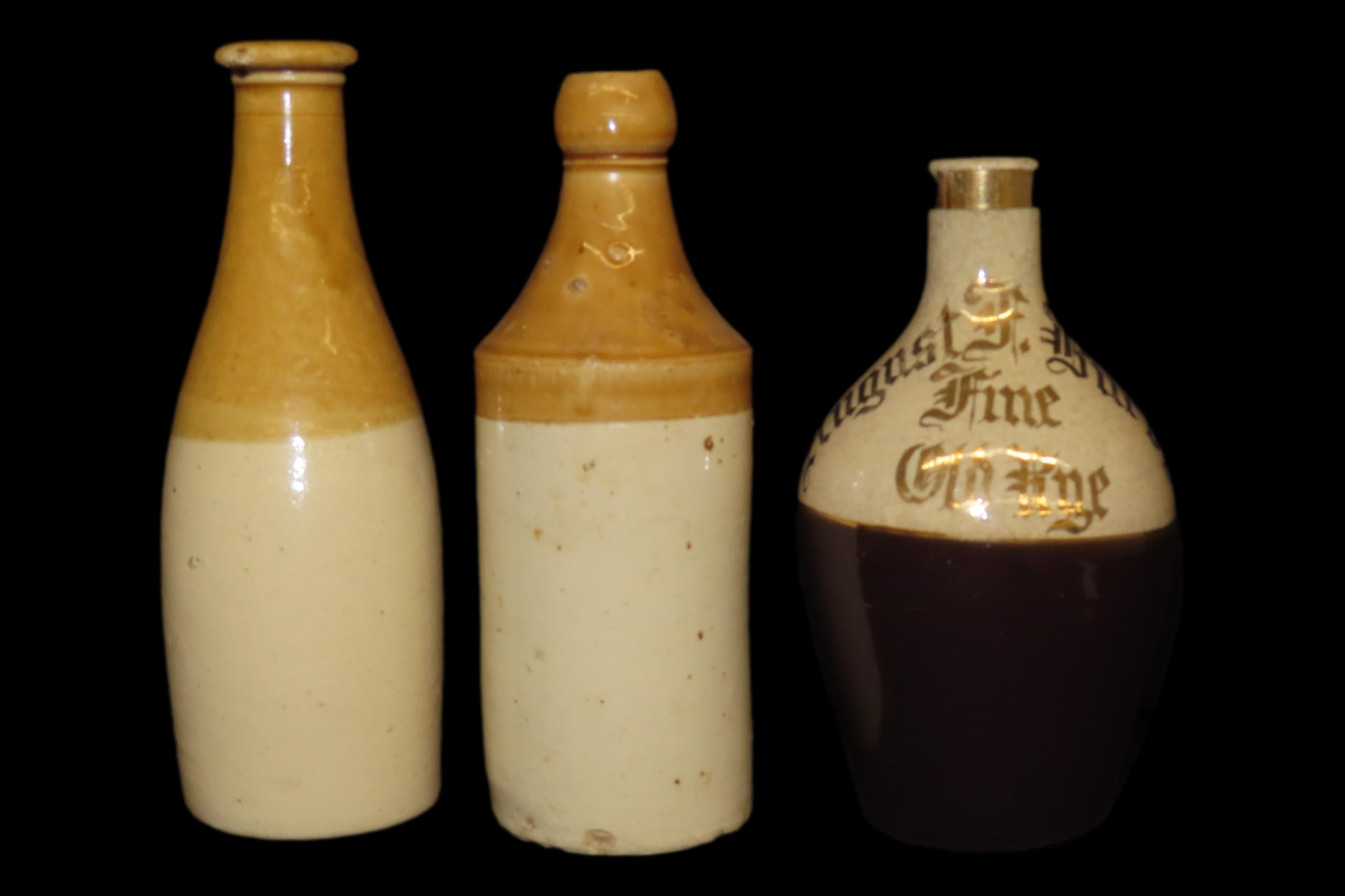 Lot of 2 Brown-in-White Ginger Bottles and 1 Advertised Rye Bottle