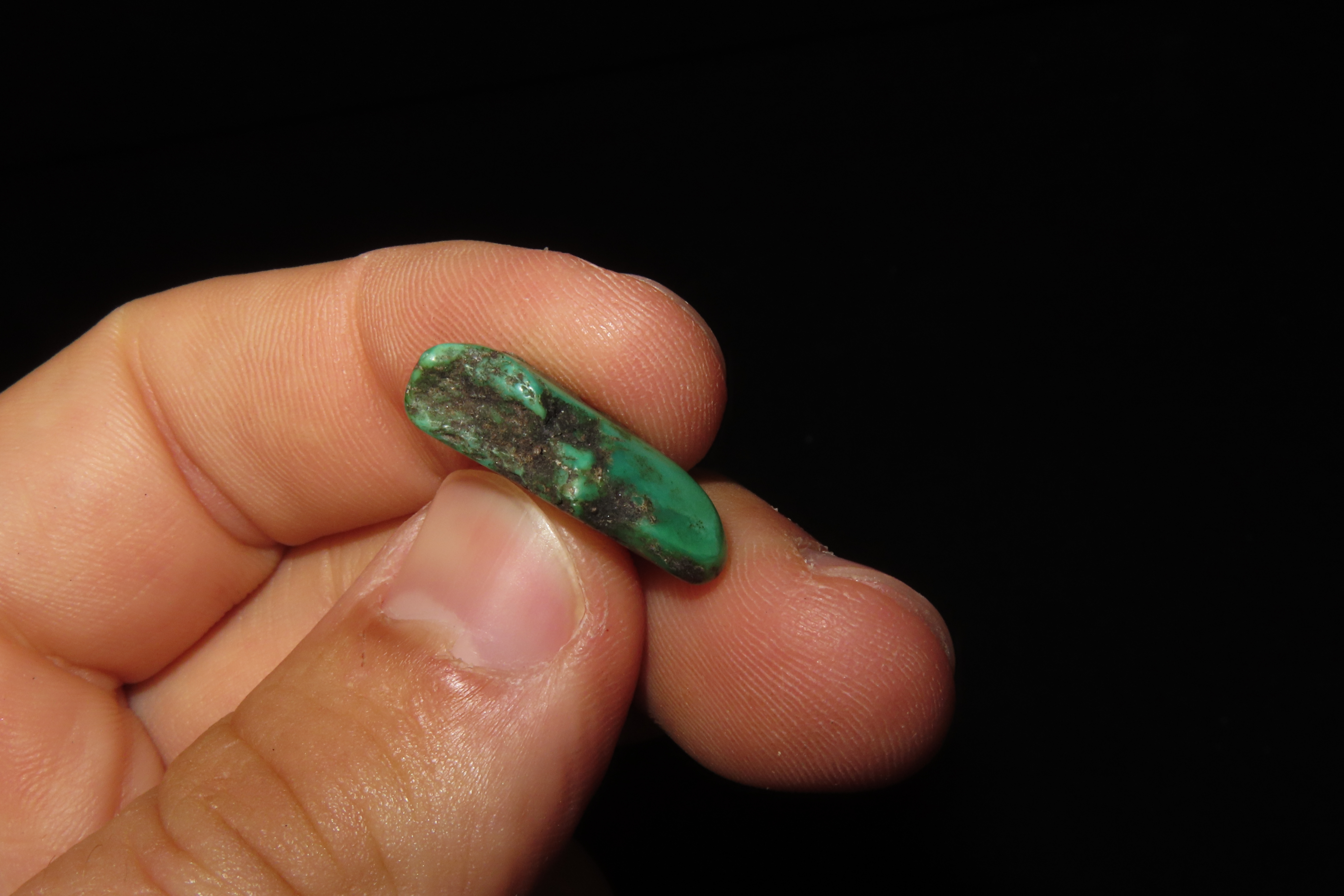 Colorful Mimbres / Hohokam Turquoise Pendant found in Arizona. Nicely shaped and polished example, drilled for suspension.