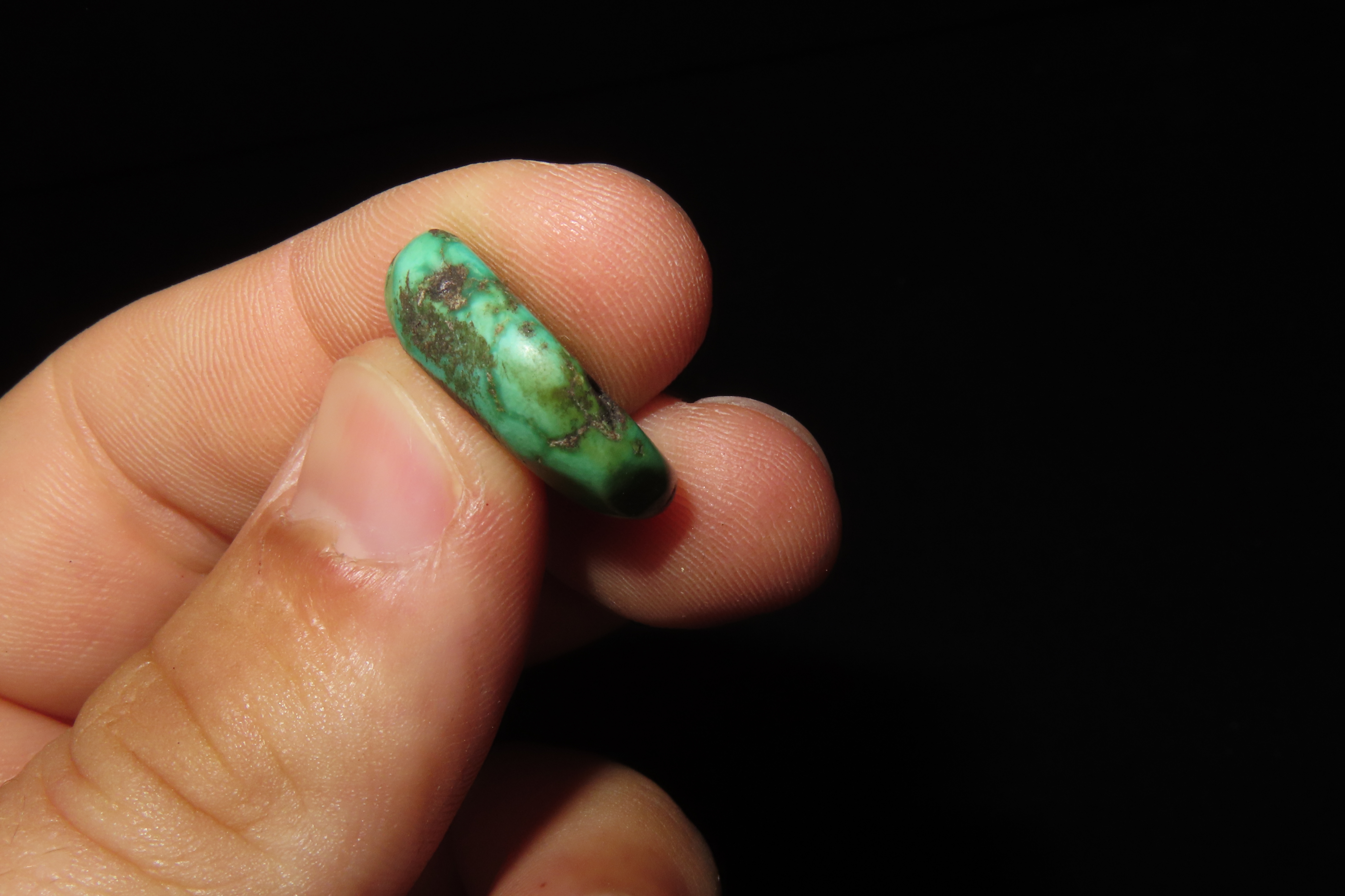 Colorful Mimbres / Hohokam Turquoise Pendant found in Arizona. Nicely shaped and polished example, drilled for suspension.