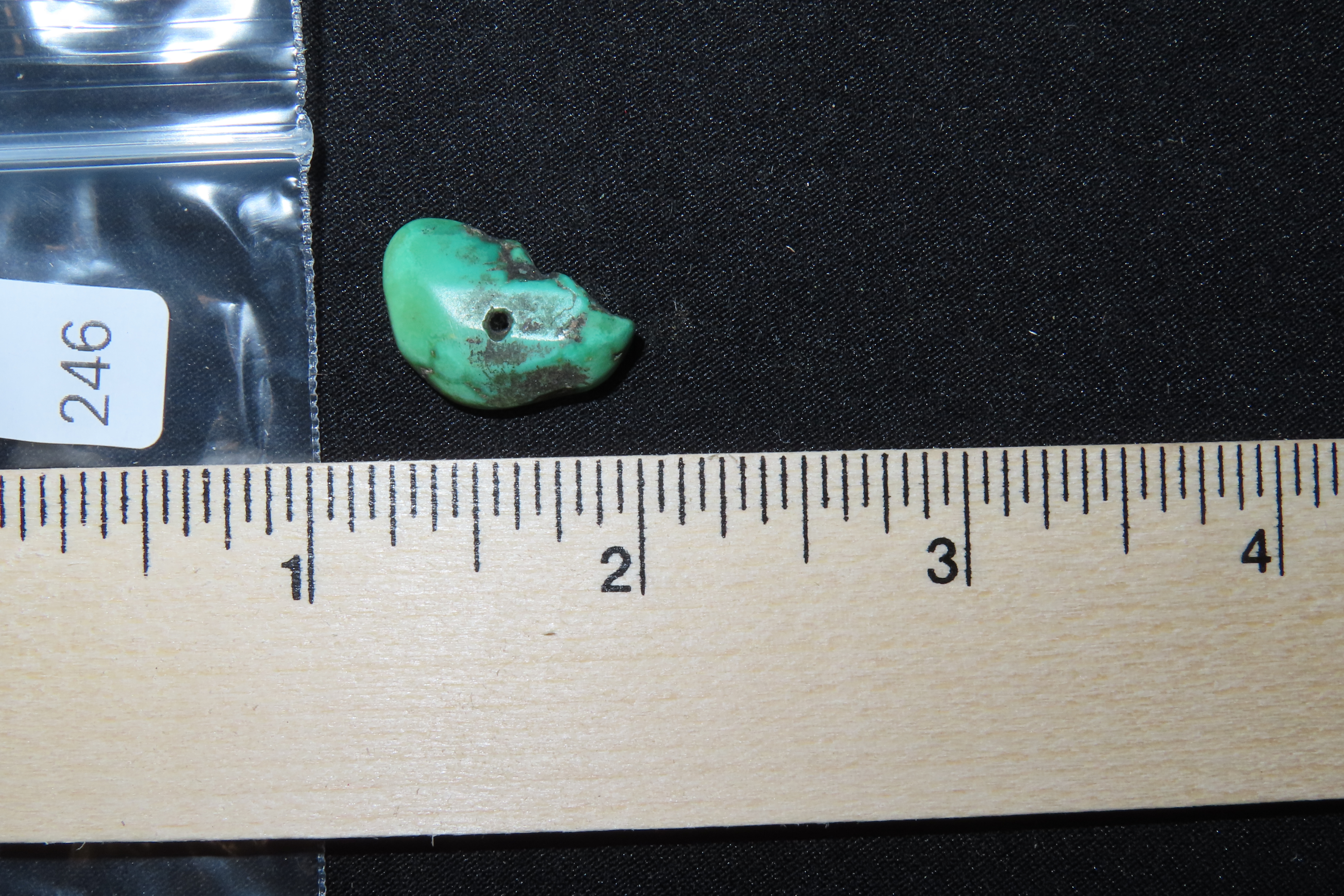 Colorful Mimbres / Hohokam Turquoise Pendant found in Arizona. Nicely shaped and polished example, drilled for suspension.