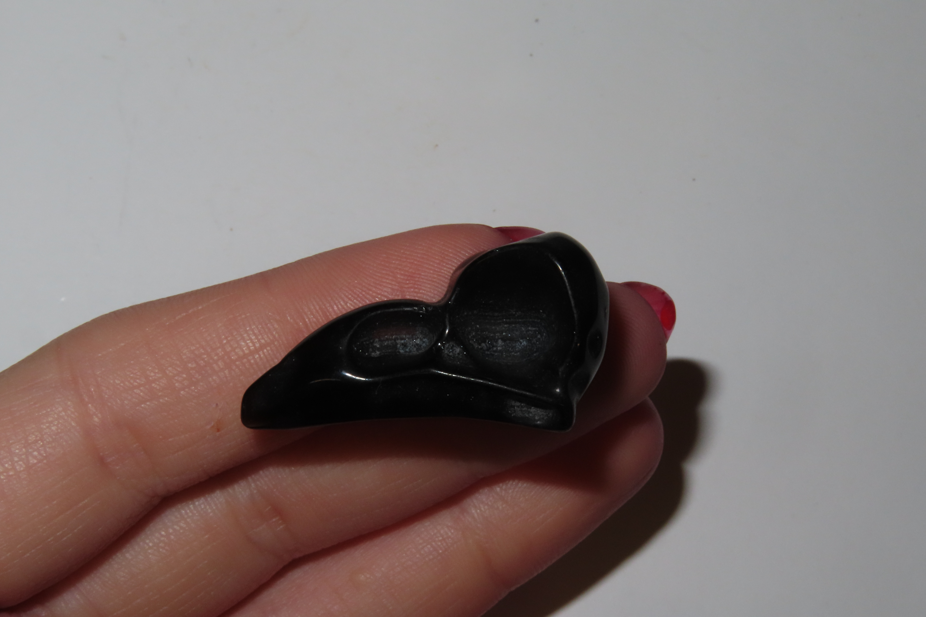 Incredible Pre-Columbian Obsidian Bird Head / Skull Effigy. Intricatly carved and polished with attention to detail. Translucent in some spo