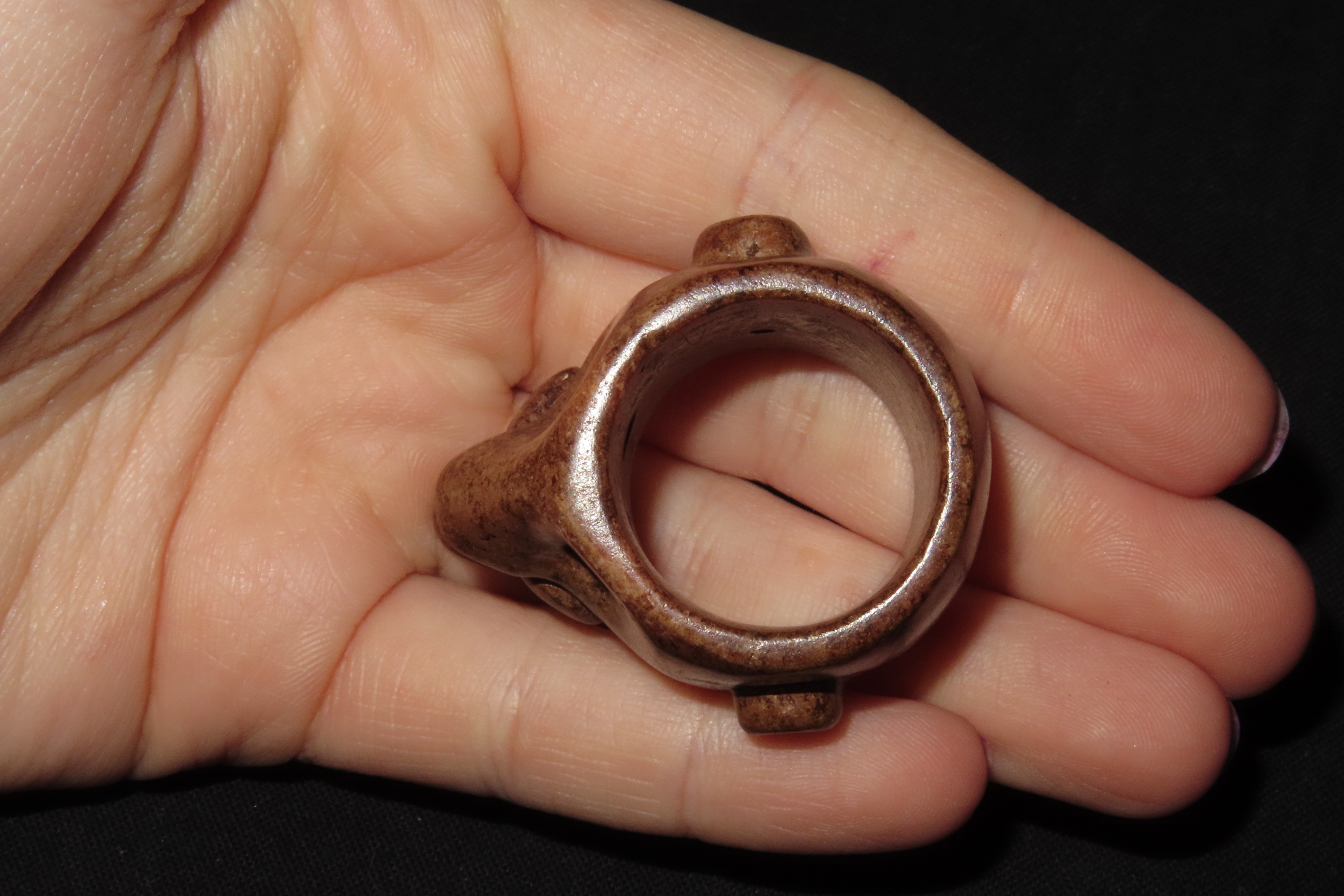 Rare Pre-Columbian Human Effigy Stone Ring. Highly Detailed and heavily Polished Brown Stone. Found in Guatemala.