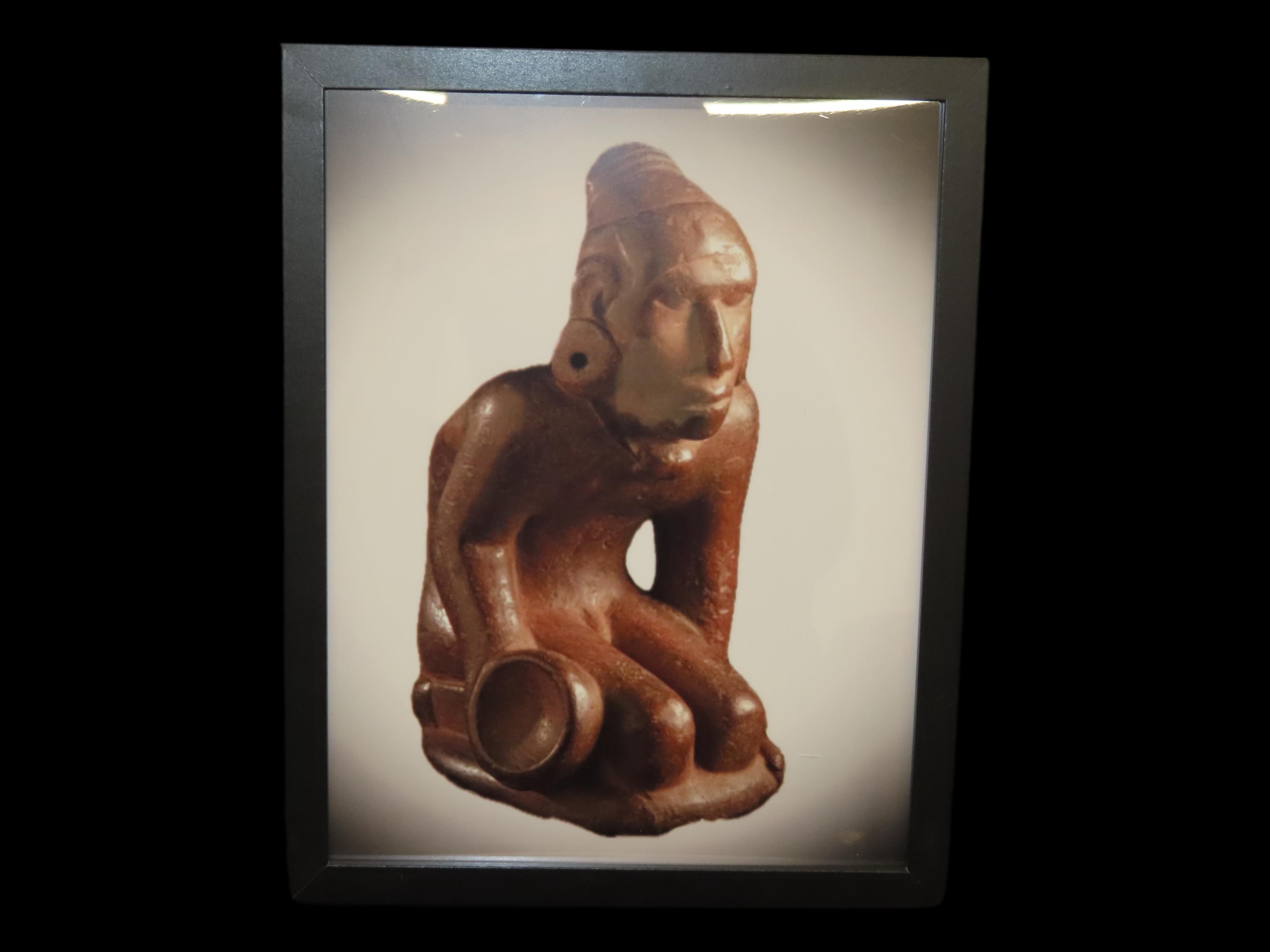 Framed 8 1/2" x 11' Picture of the Cahokia Chunkey Player Pipe found near Ocumulgee, Oklahoma in 1900. Circle Roller, Discoidal in hand.