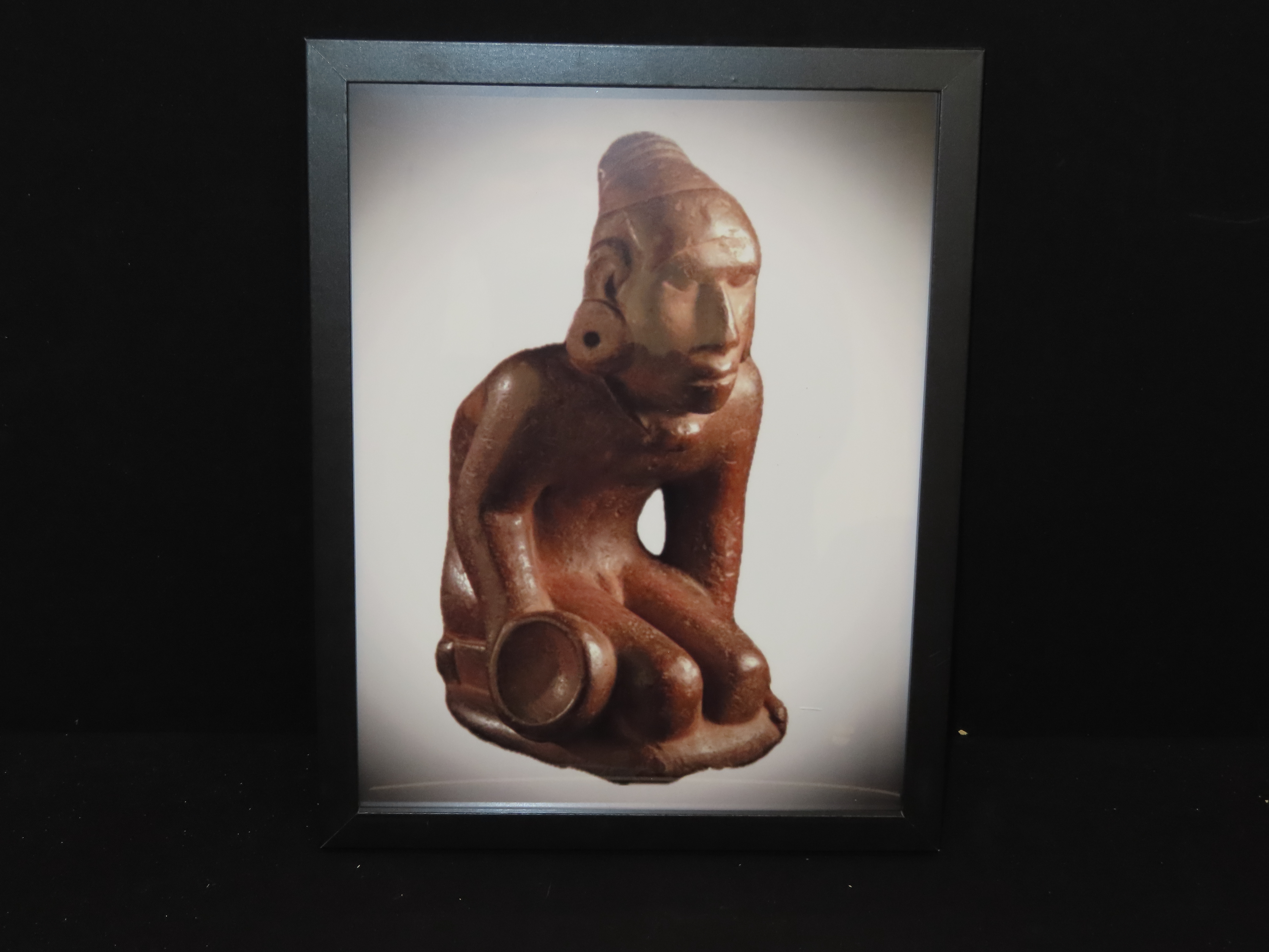 Framed 8 1/2" x 11' Picture of the Cahokia Chunkey Player Pipe found near Ocumulgee, Oklahoma in 1900. Circle Roller, Discoidal in hand.