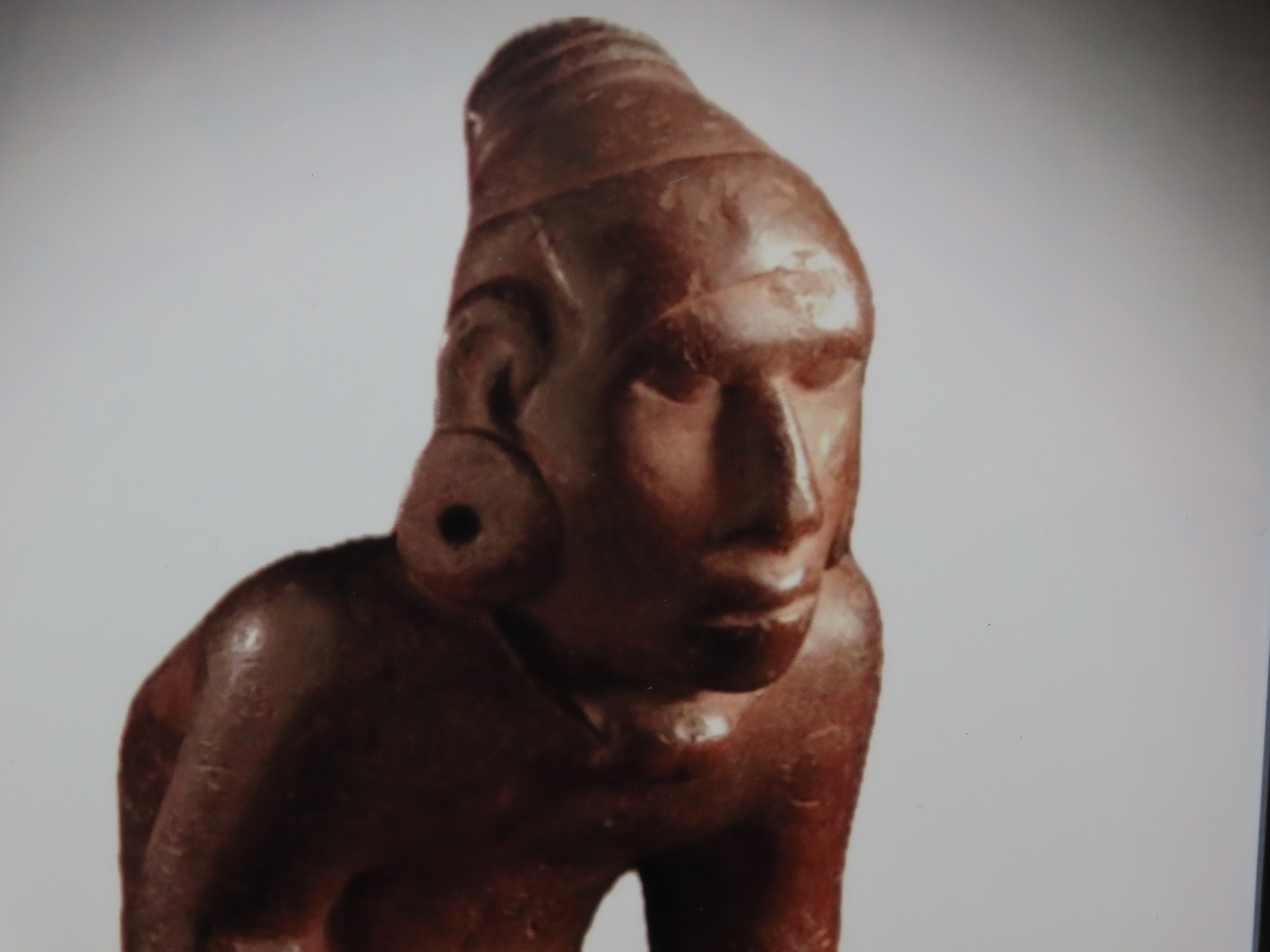 Framed 8 1/2" x 11' Picture of the Cahokia Chunkey Player Pipe found near Ocumulgee, Oklahoma in 1900. Circle Roller, Discoidal in hand.