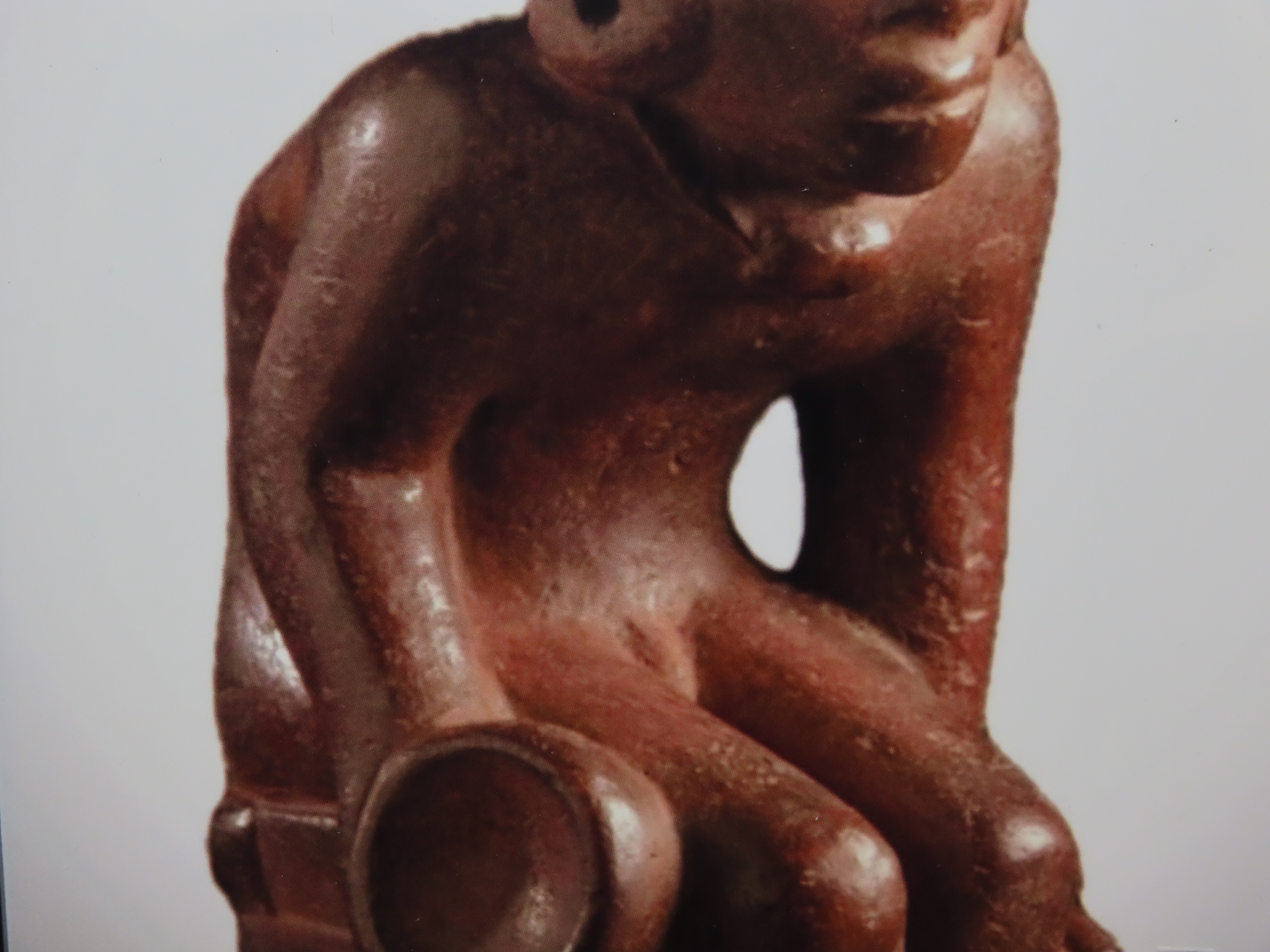 Framed 8 1/2" x 11' Picture of the Cahokia Chunkey Player Pipe found near Ocumulgee, Oklahoma in 1900. Circle Roller, Discoidal in hand.