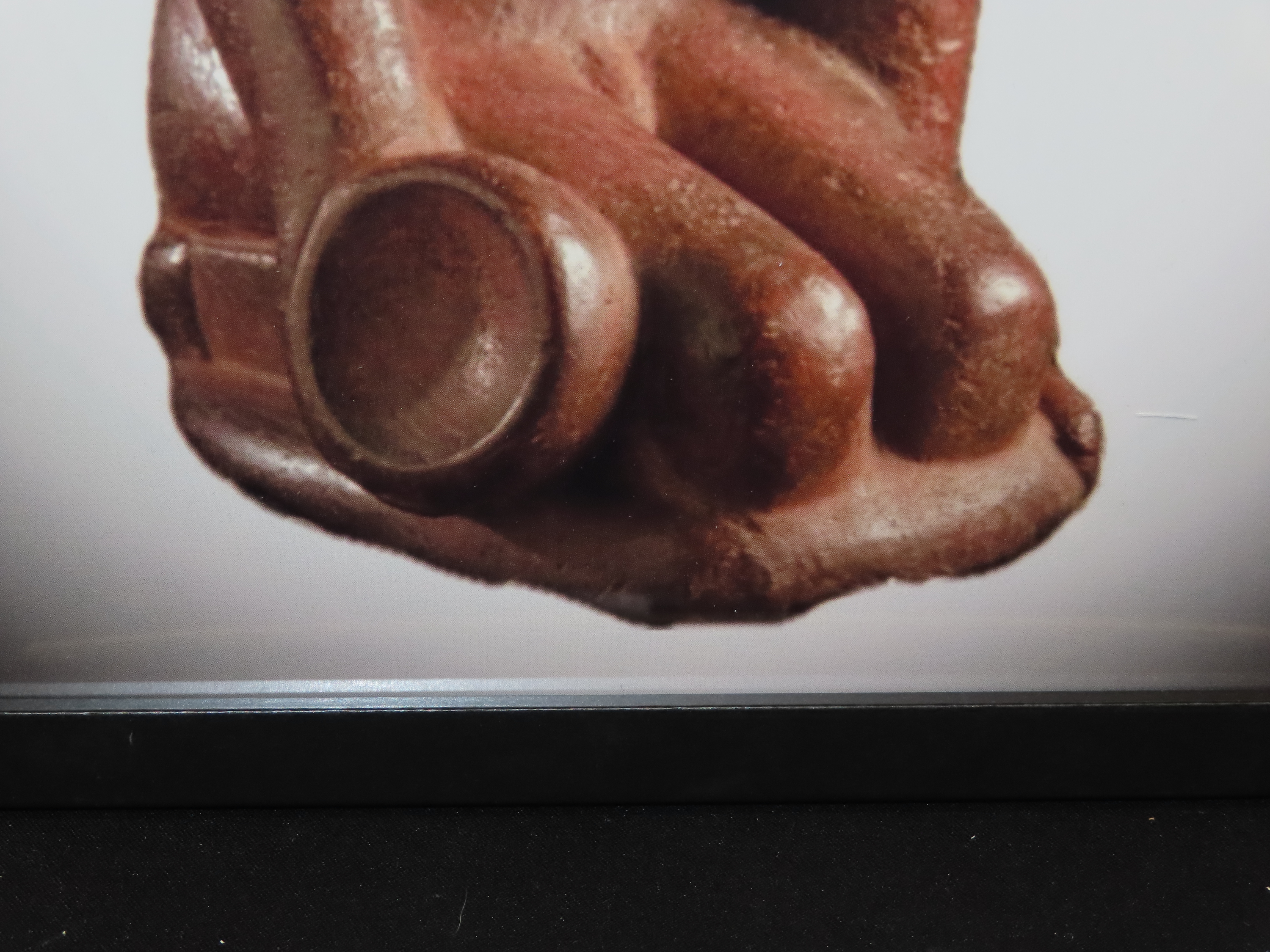 Framed 8 1/2" x 11' Picture of the Cahokia Chunkey Player Pipe found near Ocumulgee, Oklahoma in 1900. Circle Roller, Discoidal in hand.