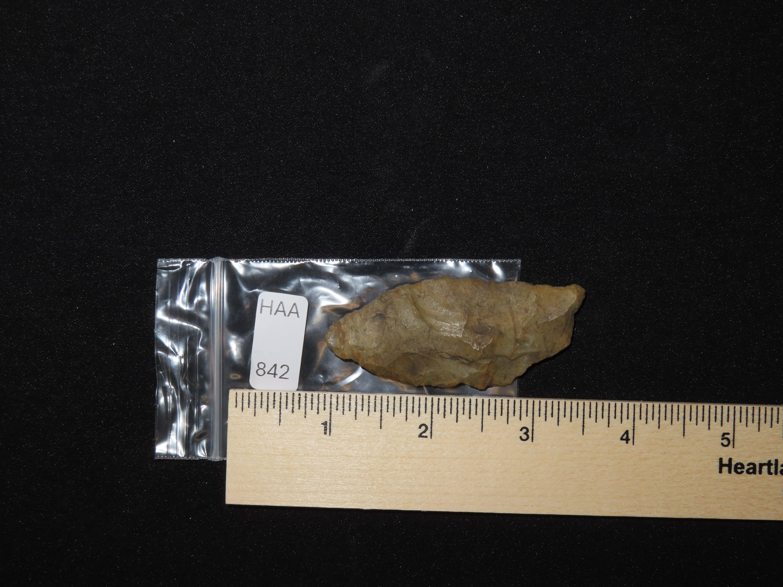 2 5/8" Paleo Suwanee found in Soutehrn Georgia. Heavily patinated old Indian Arrowhead.