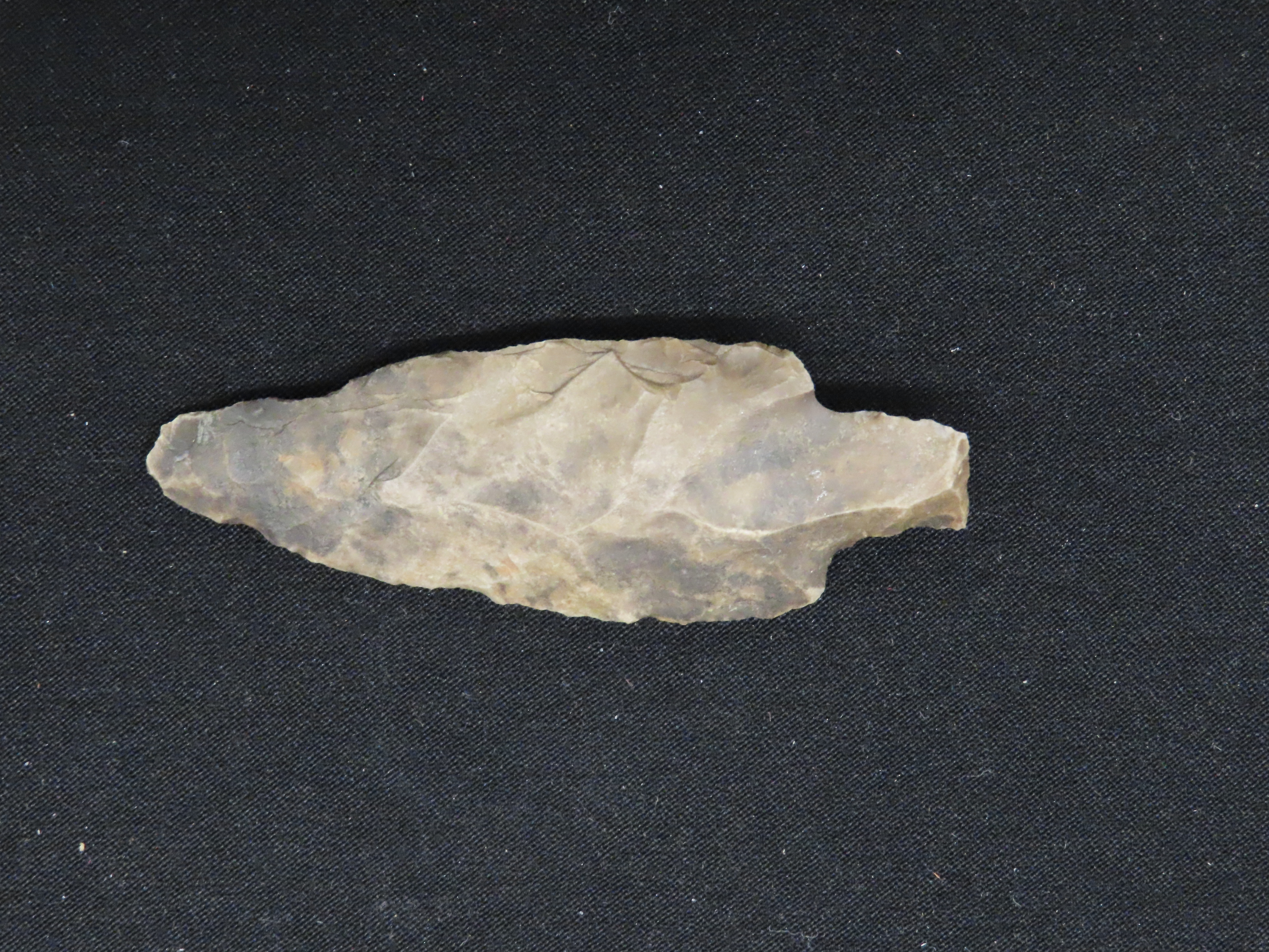 2 7/8" Heavily Patinated Archaic Stemmed Benton found in Wayne County Tennessee.