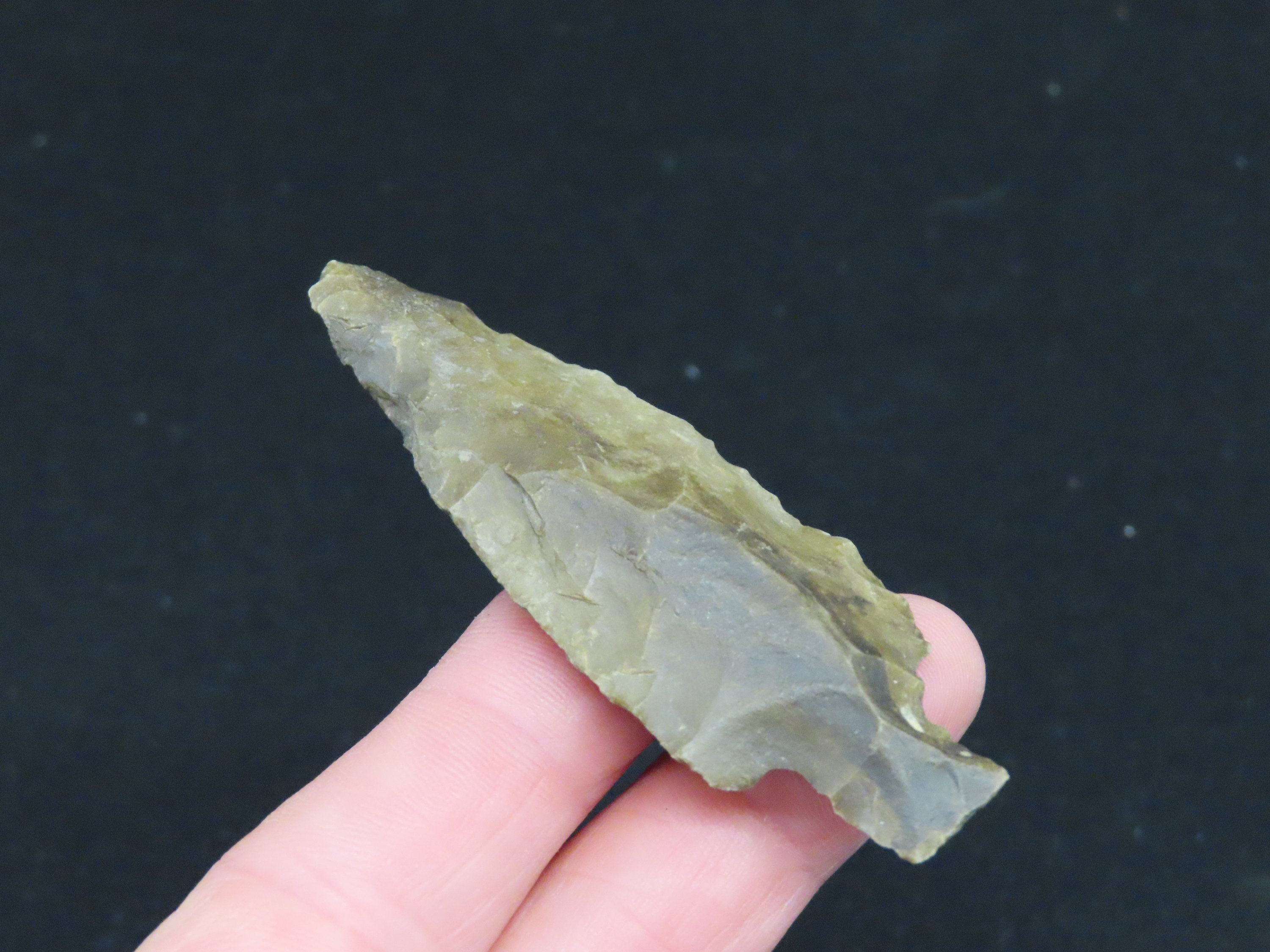 2 7/8" Heavily Patinated Archaic Stemmed Benton found in Wayne County Tennessee.