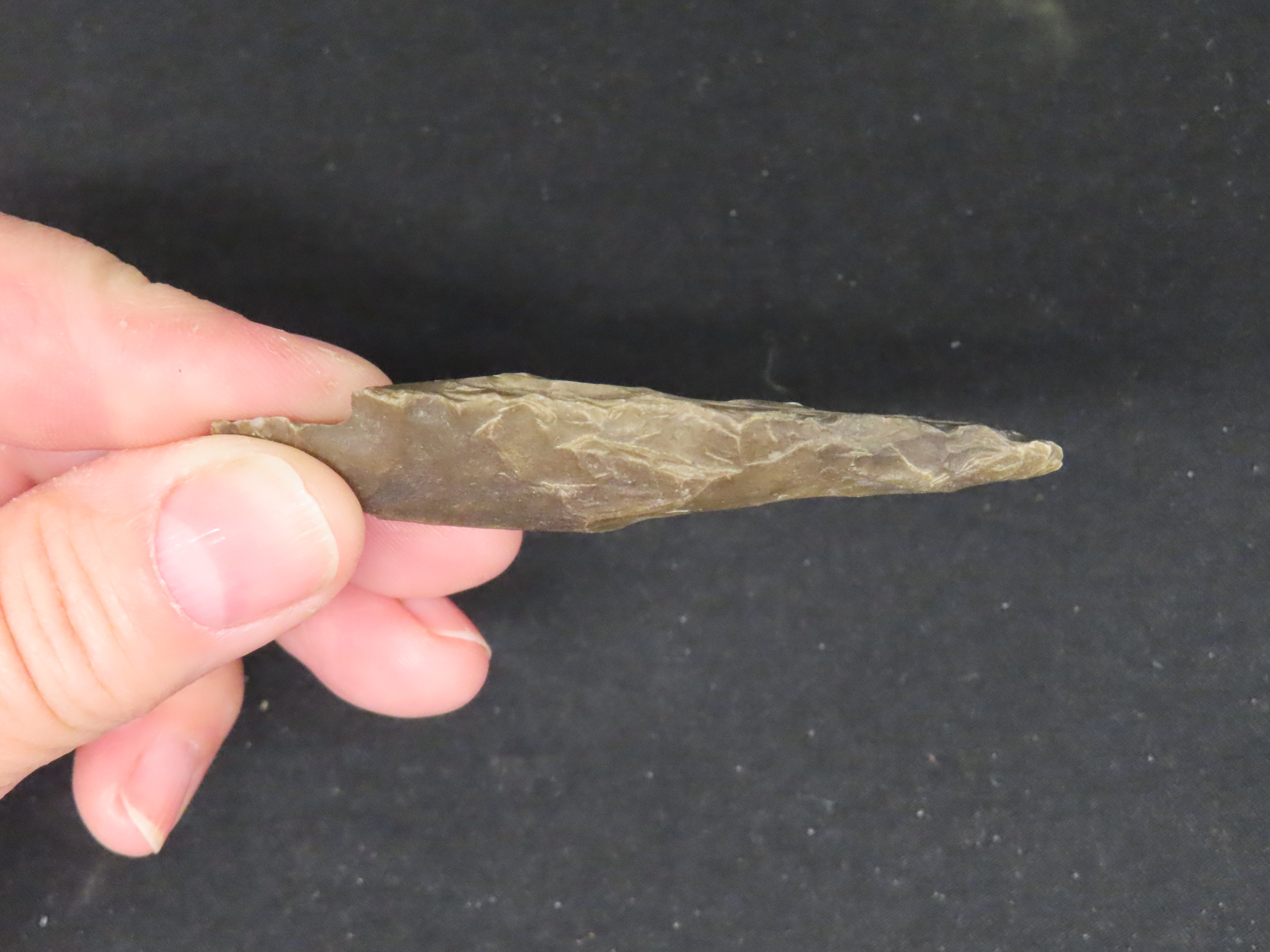 2 7/8" Heavily Patinated Archaic Stemmed Benton found in Wayne County Tennessee.