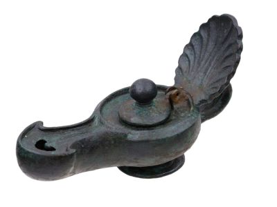 A ROMAN BRONZE LAMP WITH DECORATIVE HANDLE, CA. 1ST-2ND CENTURY AD. A characteristically Roman