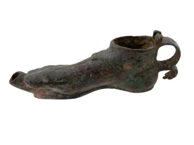 A ROMAN BRONZE LAMP IN THE FORM OF A FOOT, CA. 100 BC - 100 AD. A bronze lamp in the form of a