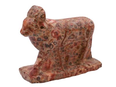 AN EGYPTIAN APIS BULL FIGURINE OF TWO-COLORED MARBLE, CA. 1ST MILLENIUM BC. A marble depiction
