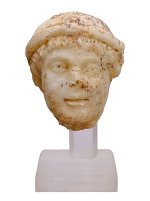 A ROMAN MARBLE HEAD OF A BEARDED YOUNG MAN, CA. 3RD OR 4TH CENTURY AD. A marble head of possible