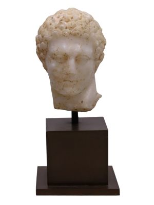 A ROMAN MARBLE HEAD OF A YOUTH, CA. 1ST-2ND CENTURY AD. A well-crafted marble bust of a young